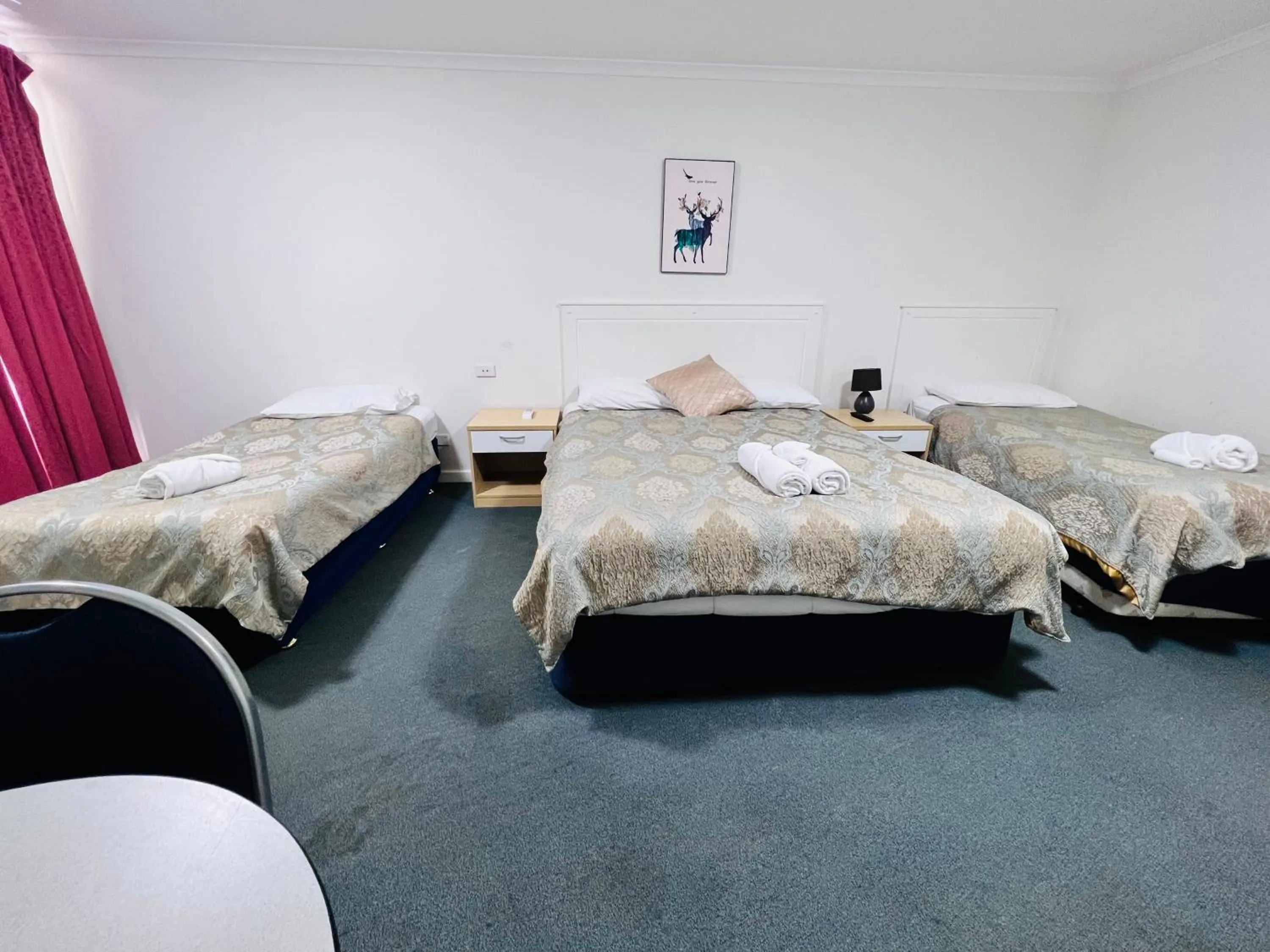 Bed in Jacksons Motor Inn