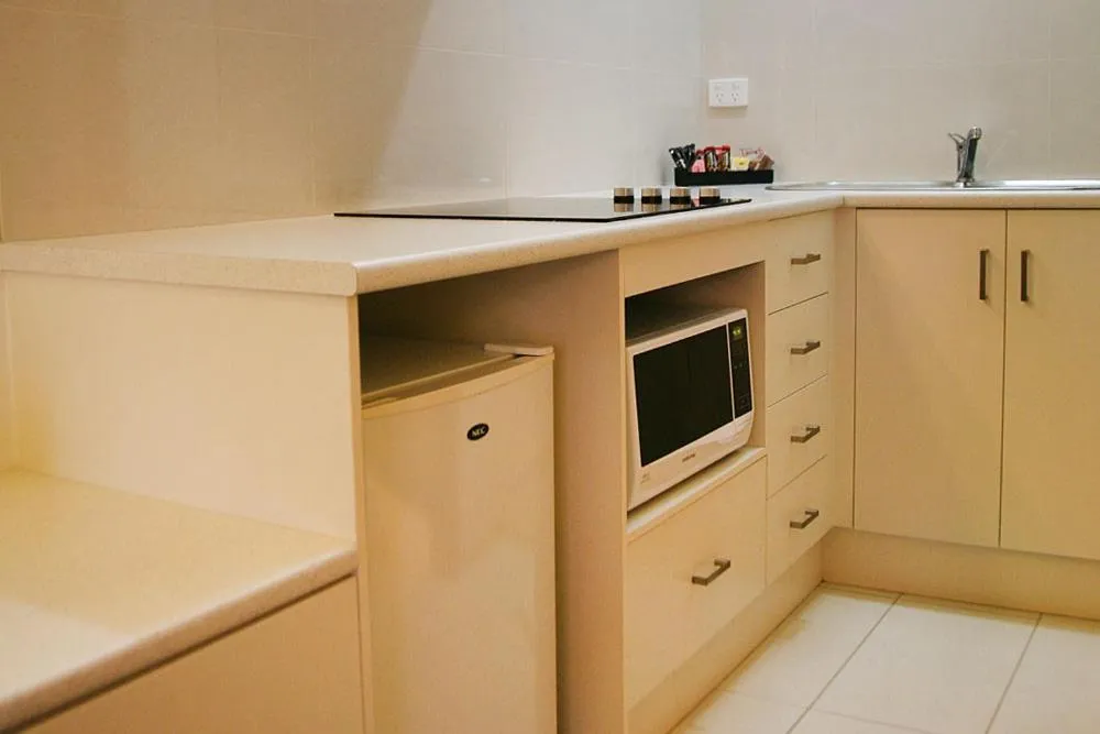 Kitchen or kitchenette in Footscray Motor Inn and Serviced Apartments