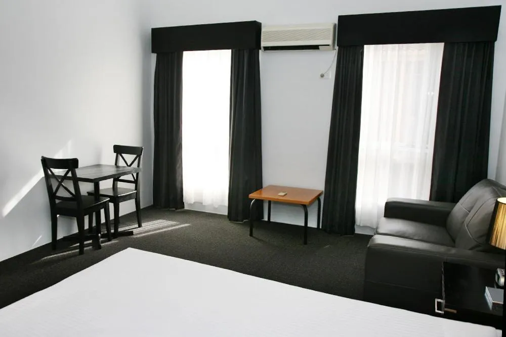 Seating area, Bed in Footscray Motor Inn and Serviced Apartments