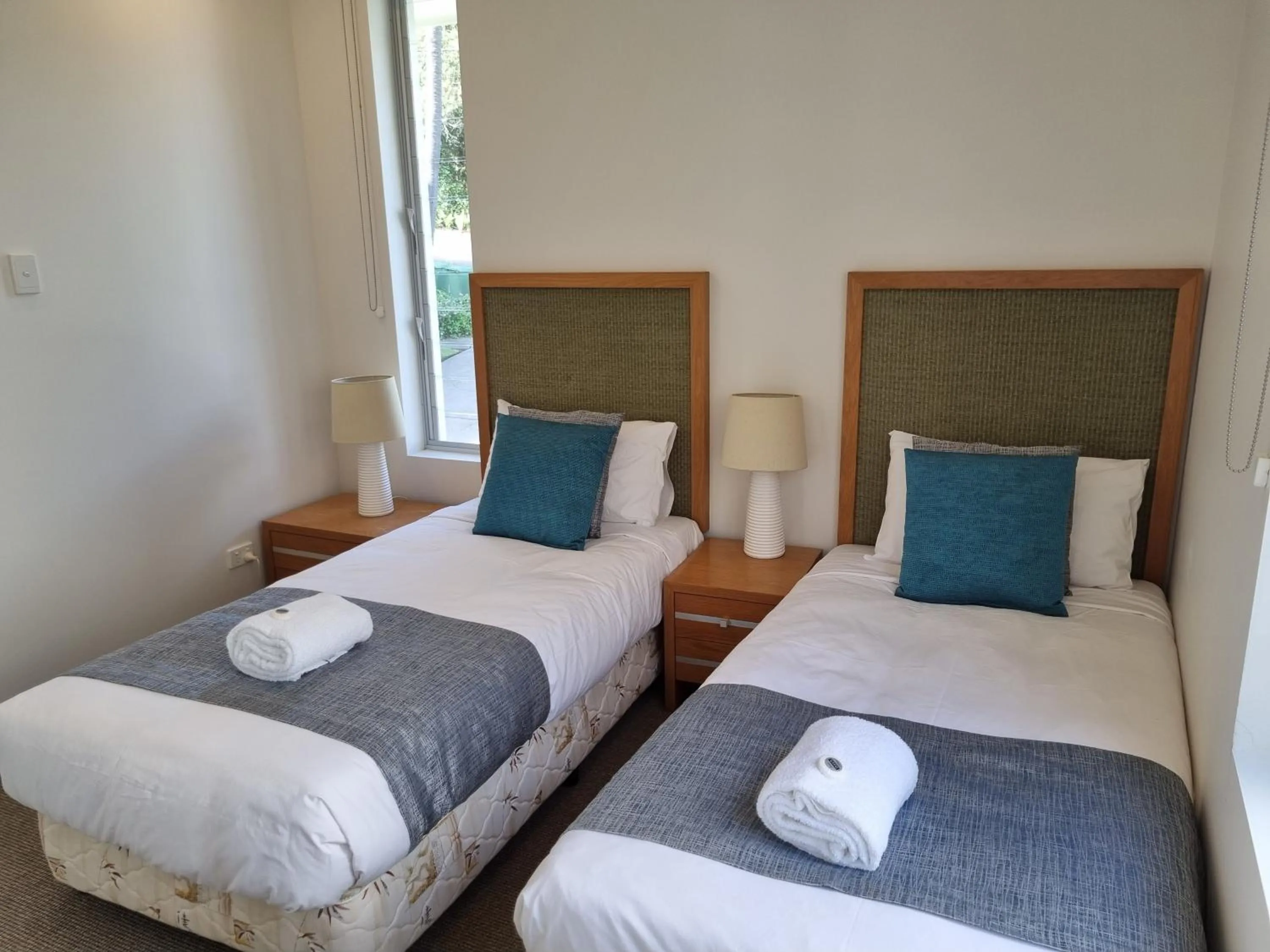 Bed in Rainbow Ocean Palms Resort