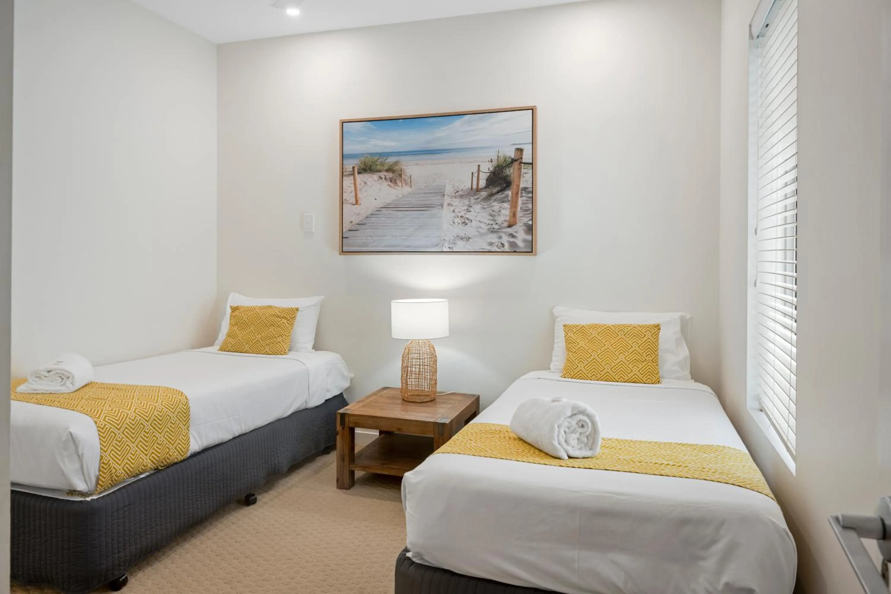 Bed in Rainbow Ocean Palms Resort