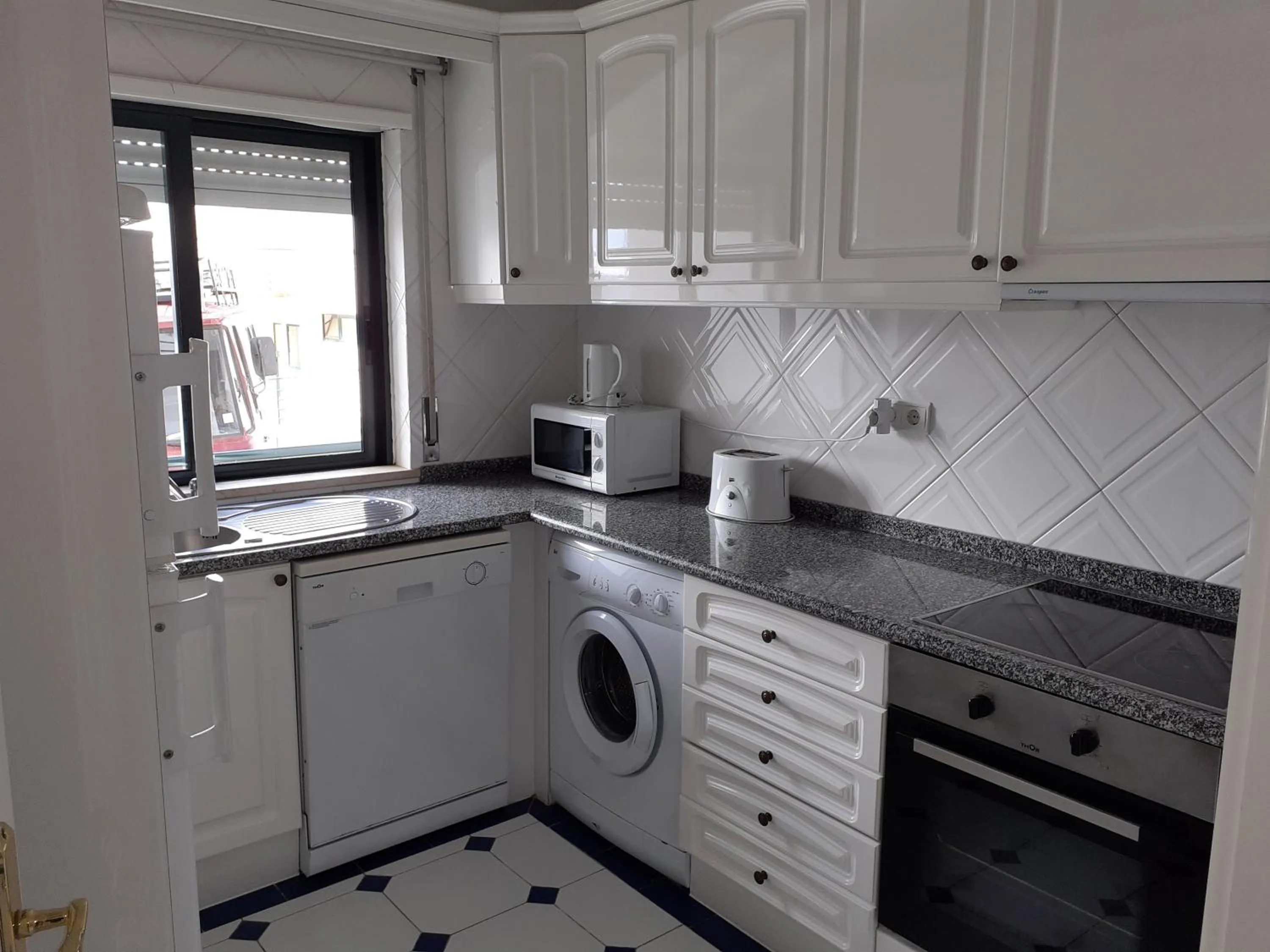 Kitchen or kitchenette in Clube Meia Praia