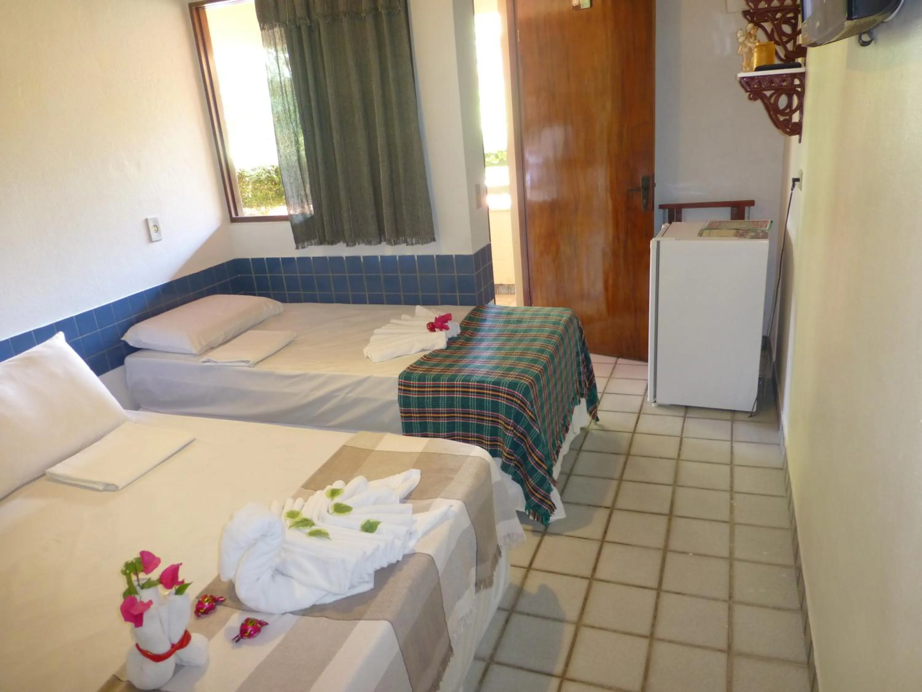 Bed in Pousada das Bromélias