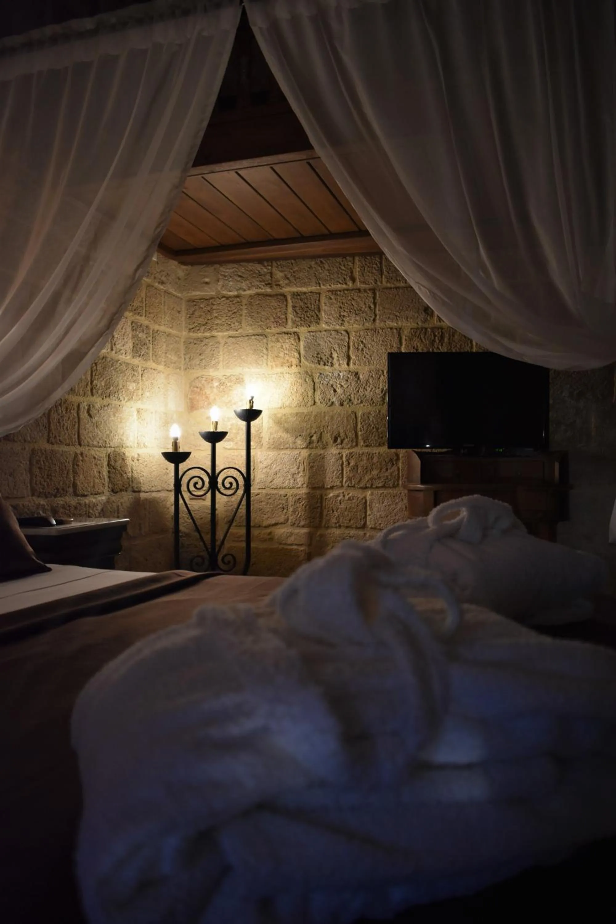 Decorative detail, Bed in S.Nikolis' Historic Boutique Hotel