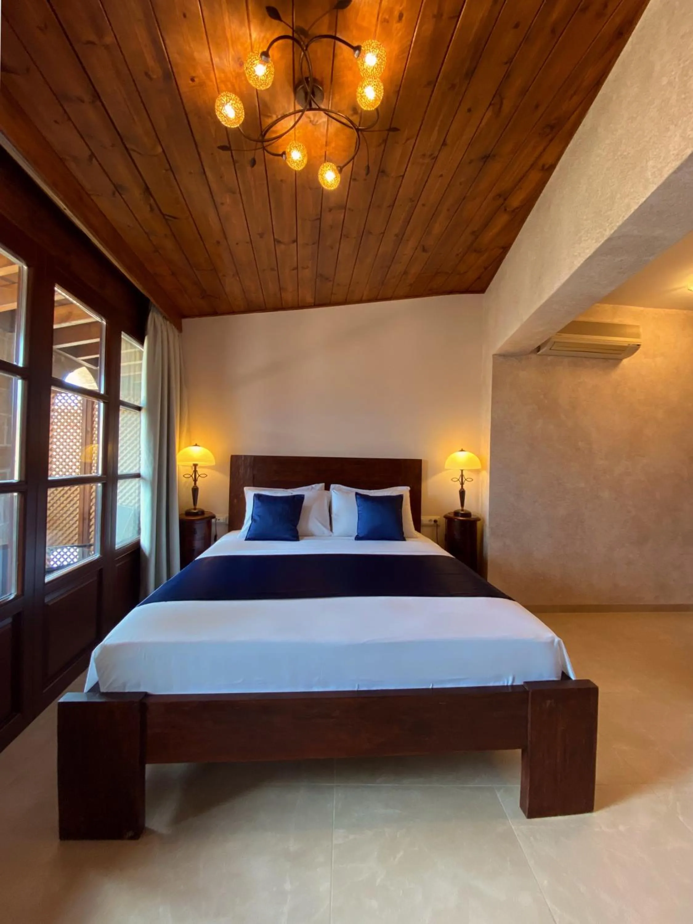 Bed in S.Nikolis' Historic Boutique Hotel