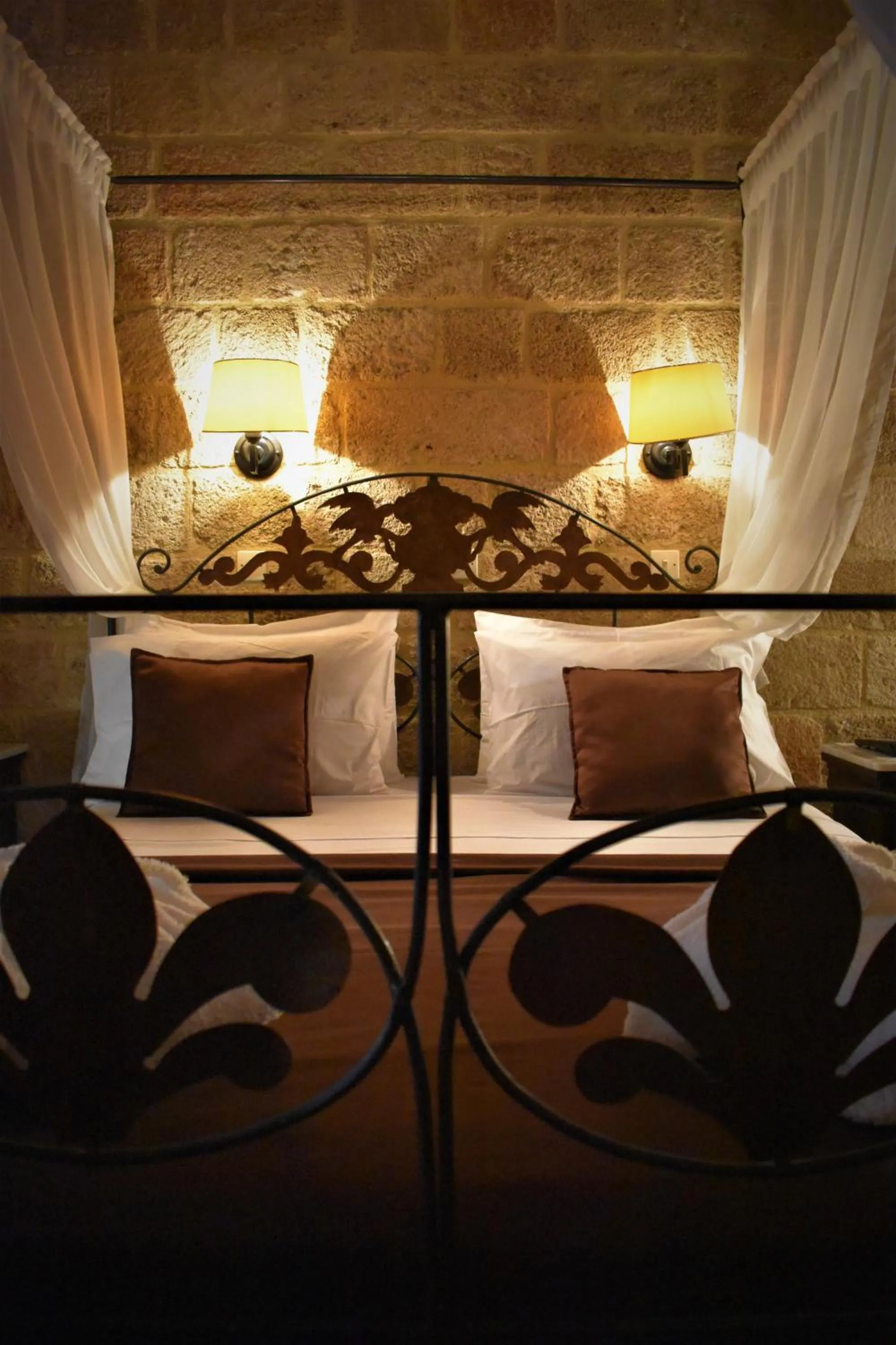 Bed in S.Nikolis' Historic Boutique Hotel