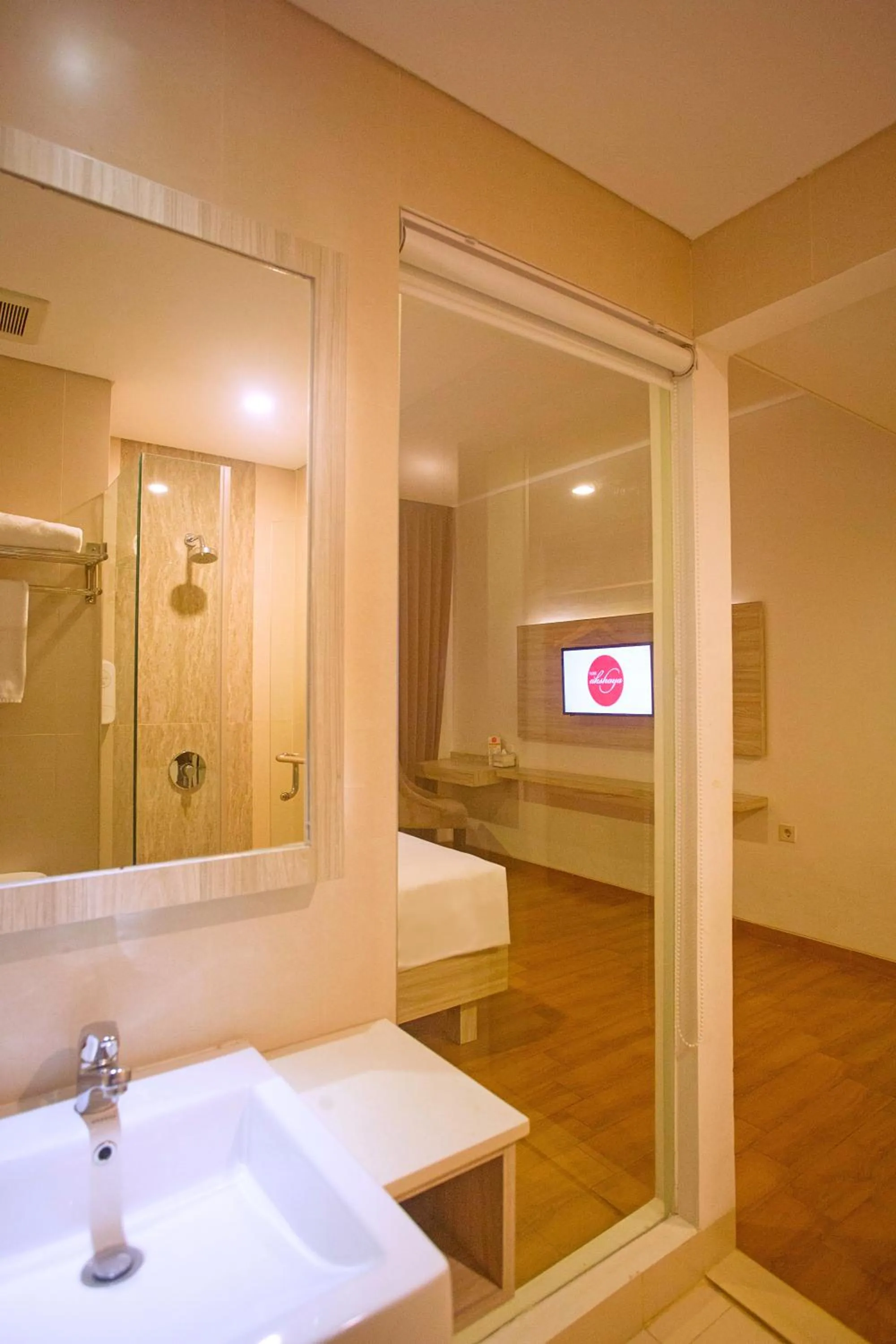 Bathroom, Bed in Front One Akshaya Hotel Karawang