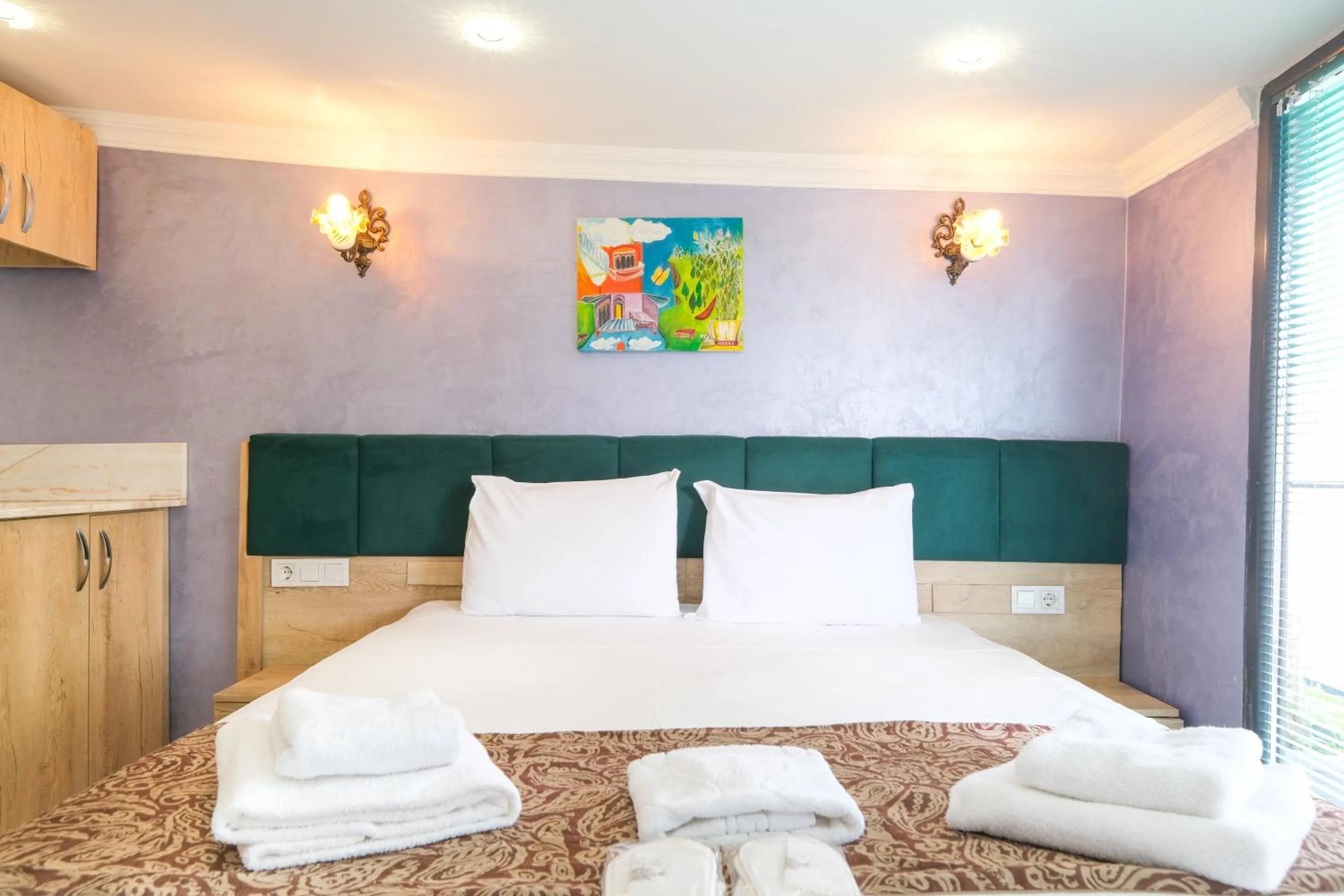 Bed in Loren Hotel&Suites