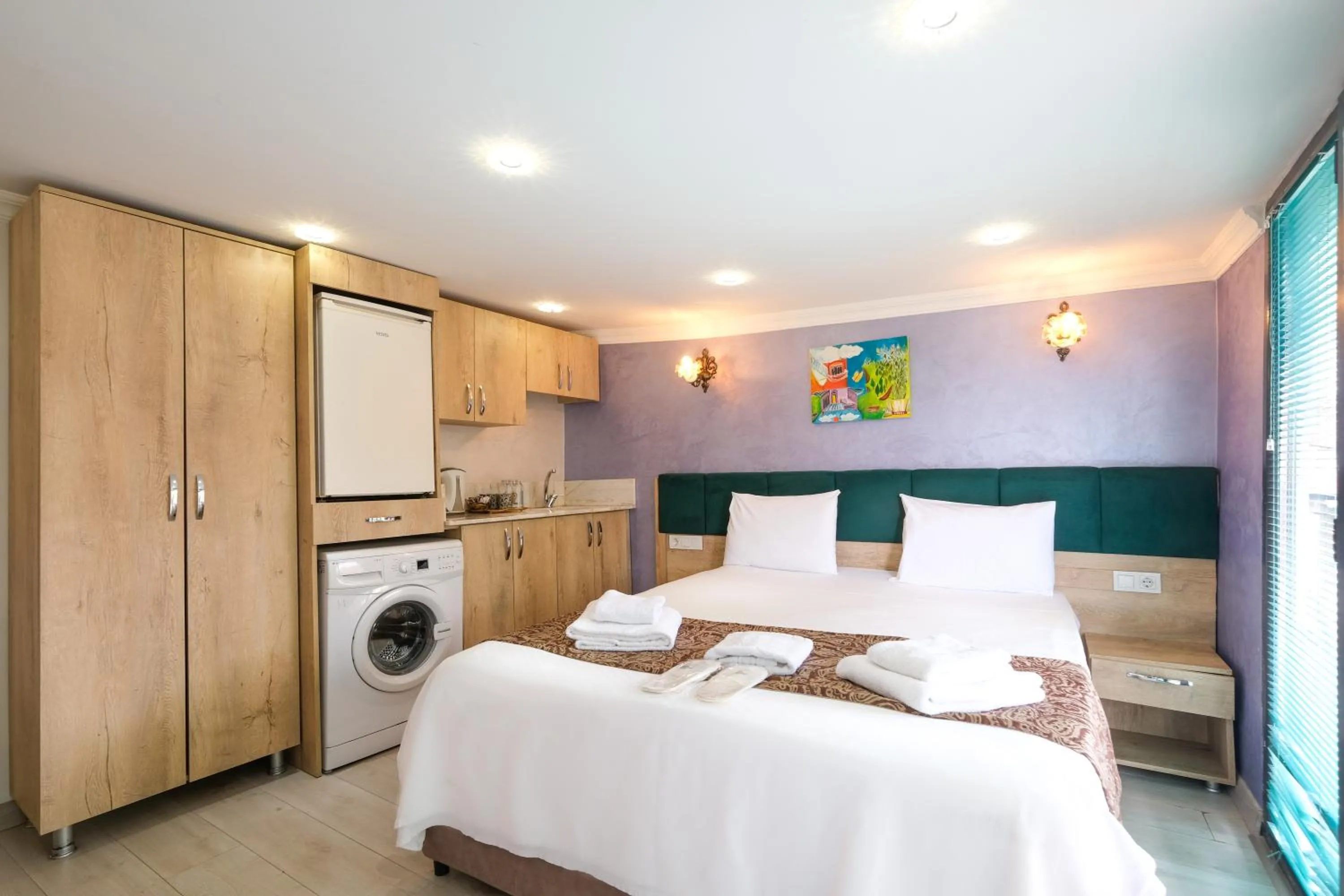 Bed in Loren Hotel&Suites