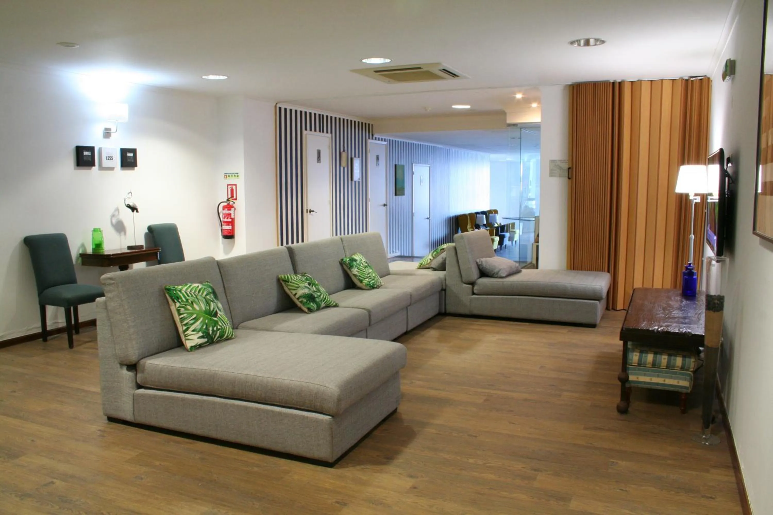 Communal lounge/ TV room in Vinha da Areia Beach Hotel