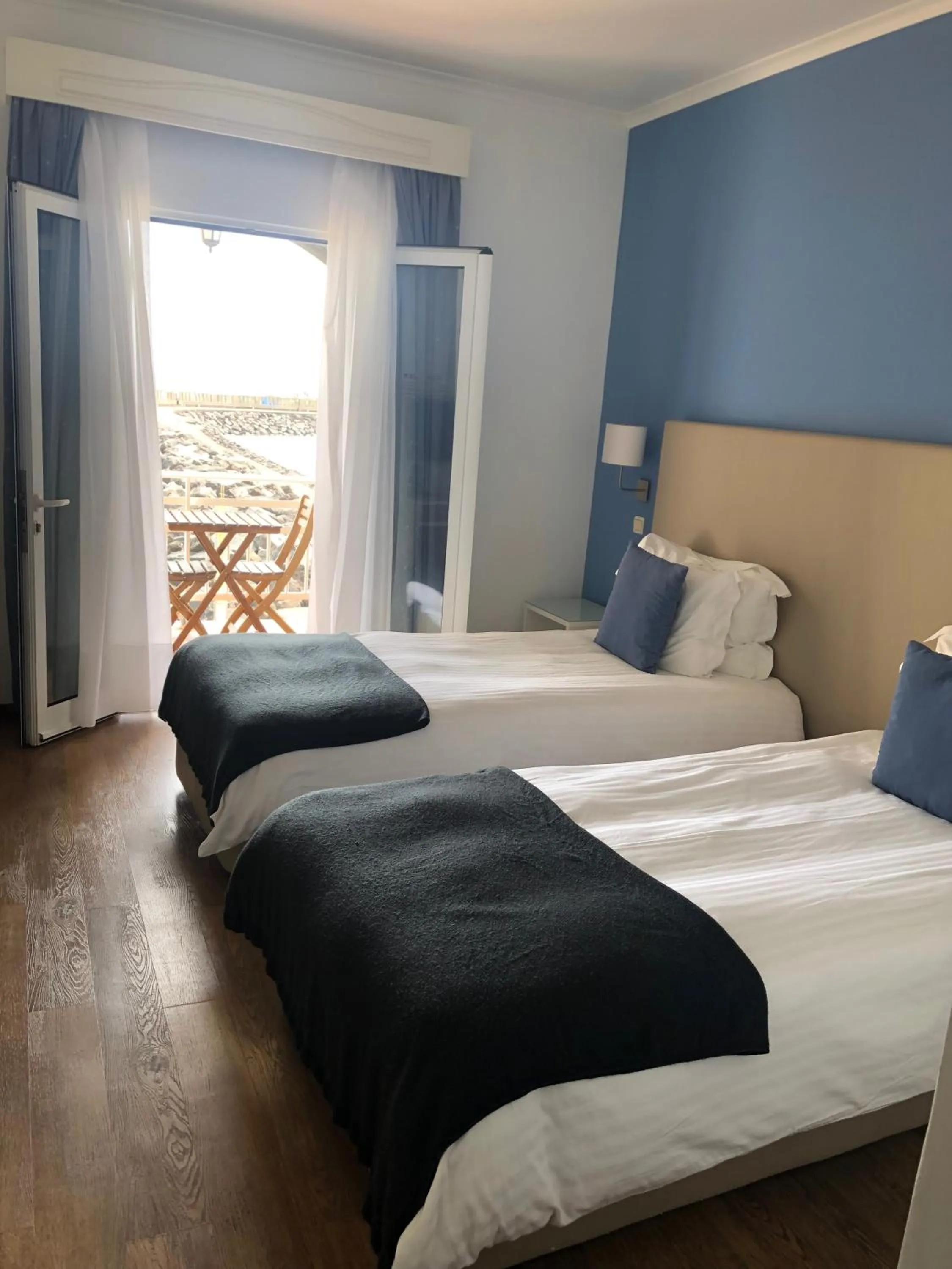 Bedroom, Bed in Vinha da Areia Beach Hotel