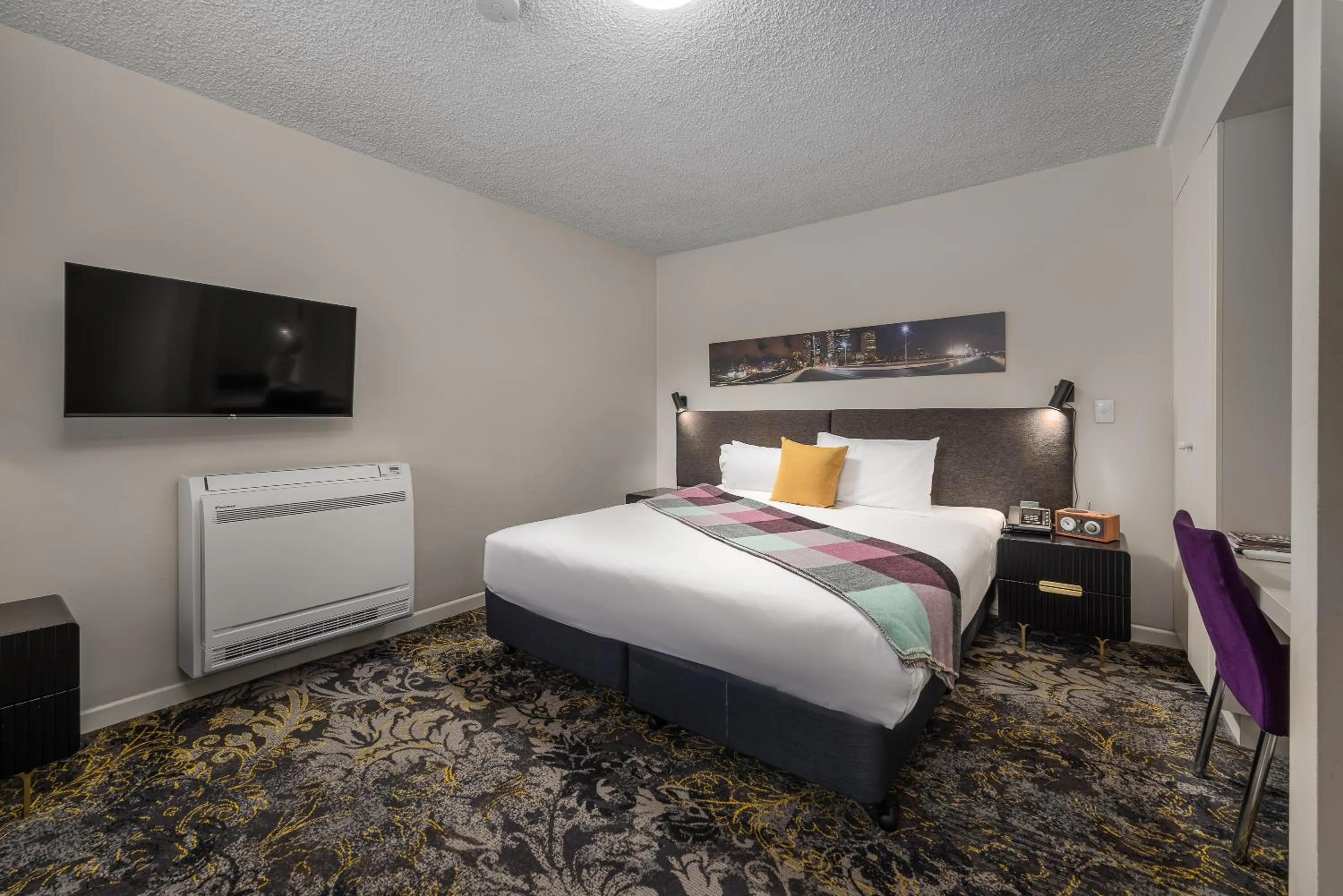 Bed in City Limits Hotel Apartments