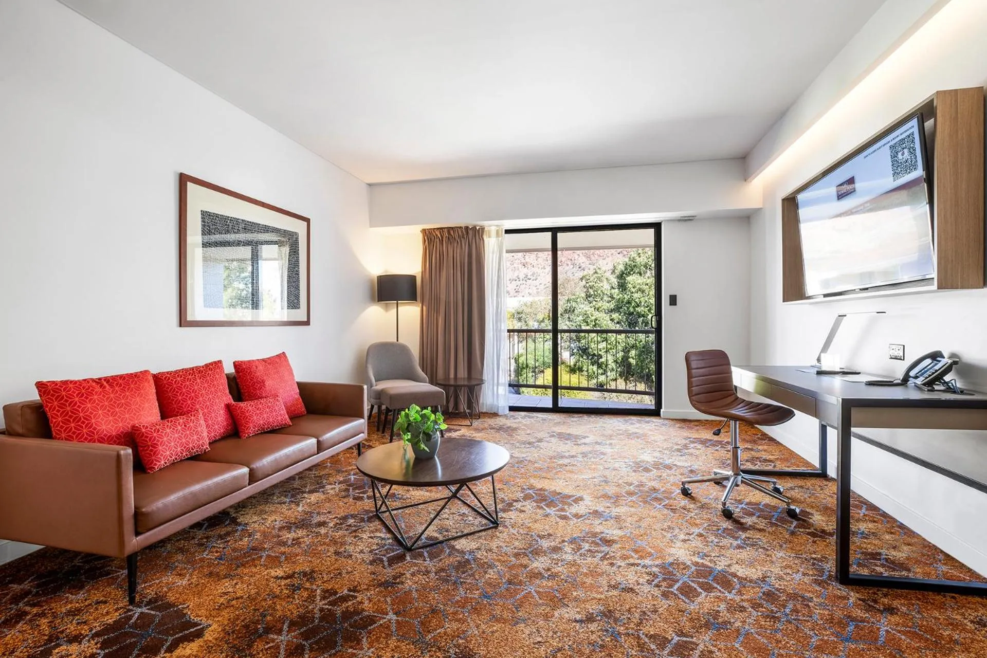 Communal lounge/ TV room in Crowne Plaza Alice Springs Lasseters by IHG