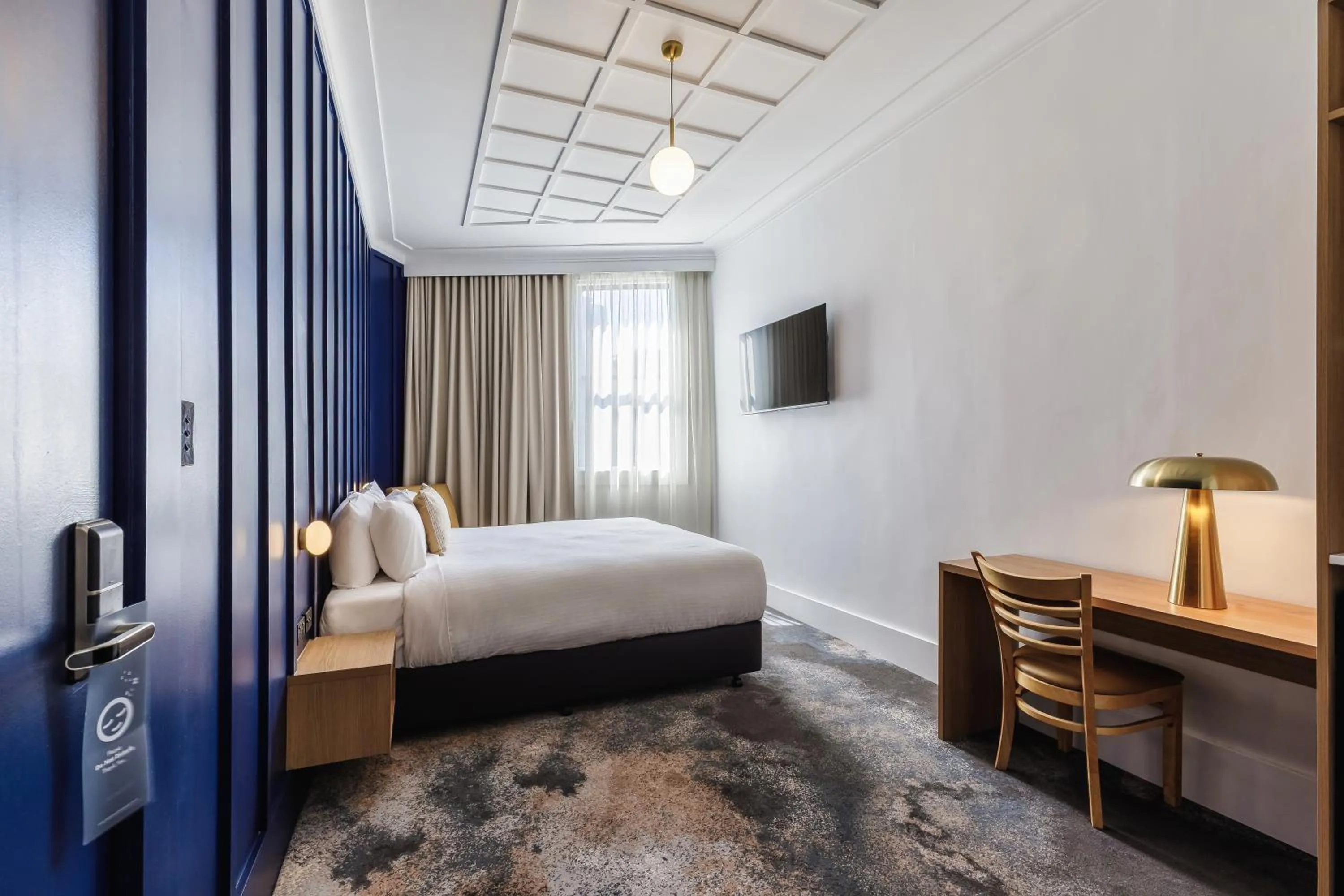 Bed in Royal Exhibition Hotel