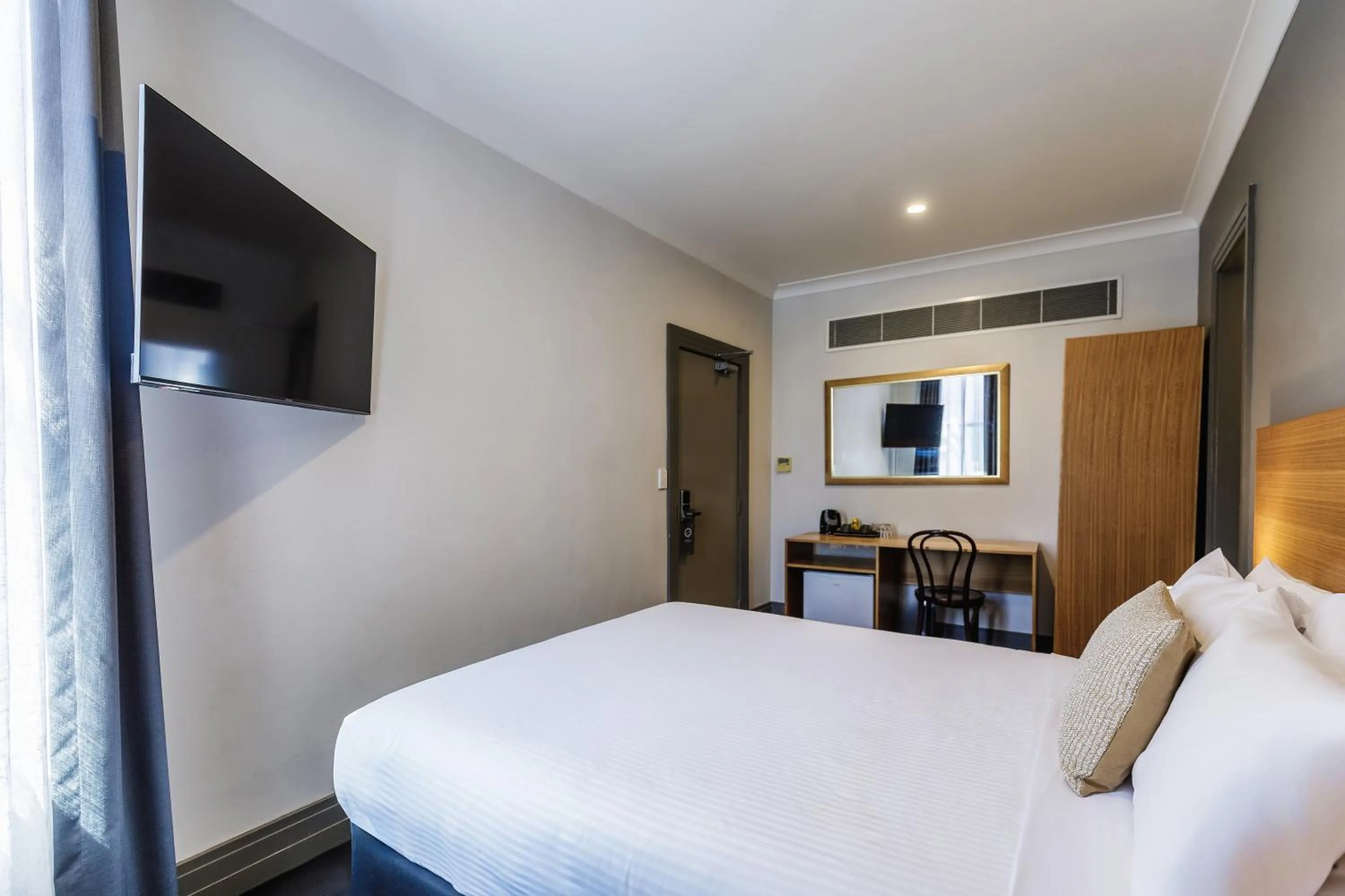 Bed in Royal Exhibition Hotel