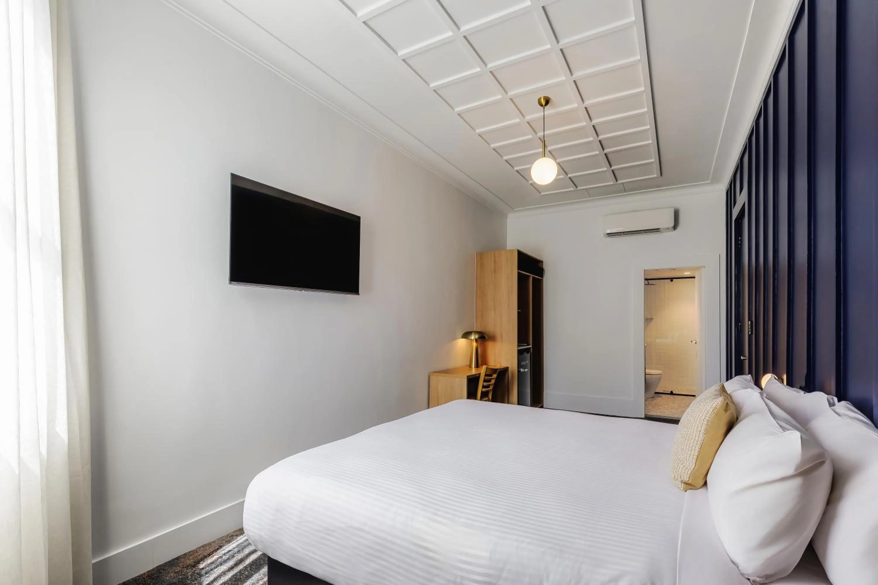 Bed in Royal Exhibition Hotel