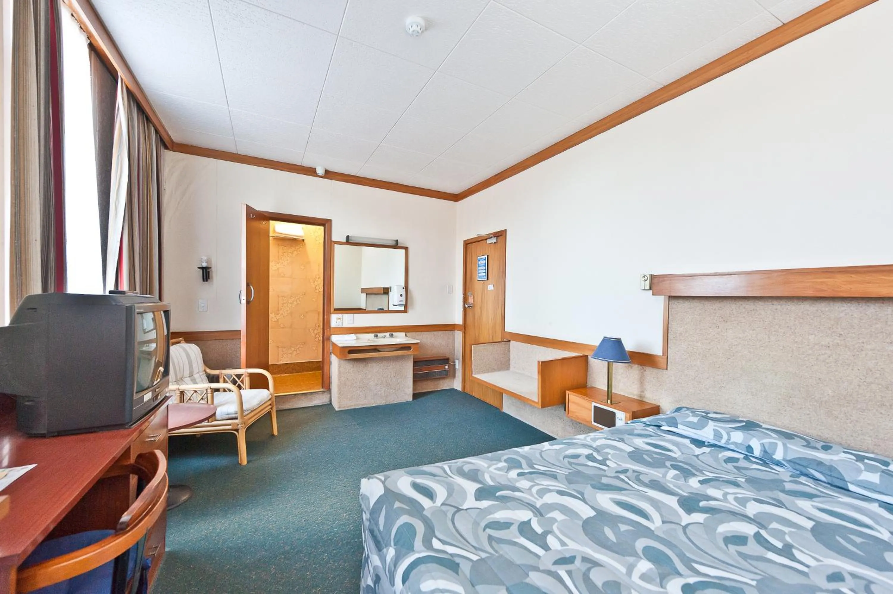 Bed in The Grand Hotel Wanganui