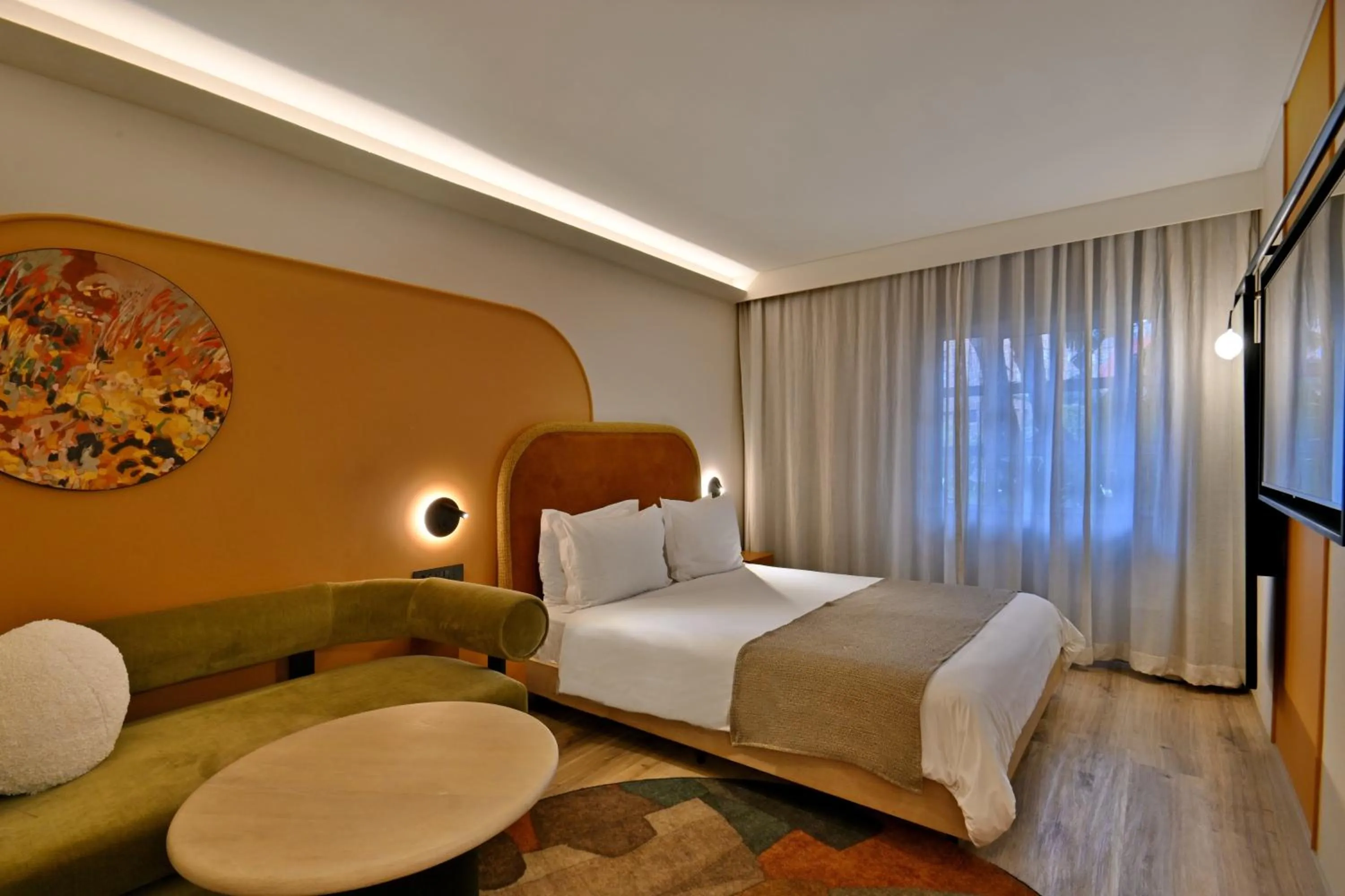 Communal lounge/ TV room, Bed in City Lodge Hotel V&A Waterfront