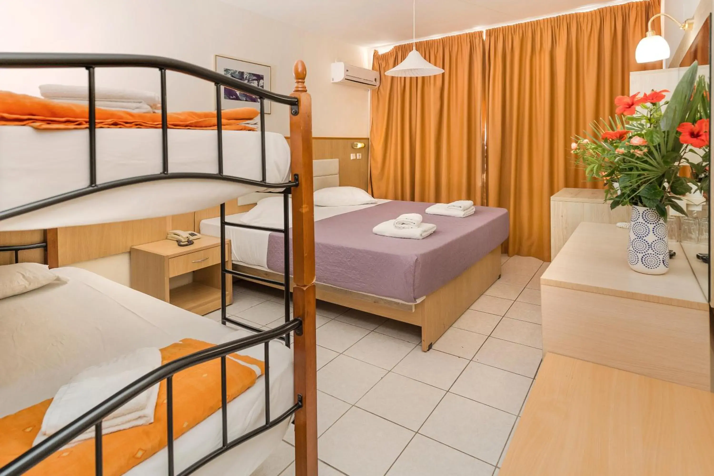 Quadruple Room with Garden View in Eri Beach & Village Hotel Quadruple Room with Garden View in Eri Beach & Village Hotel