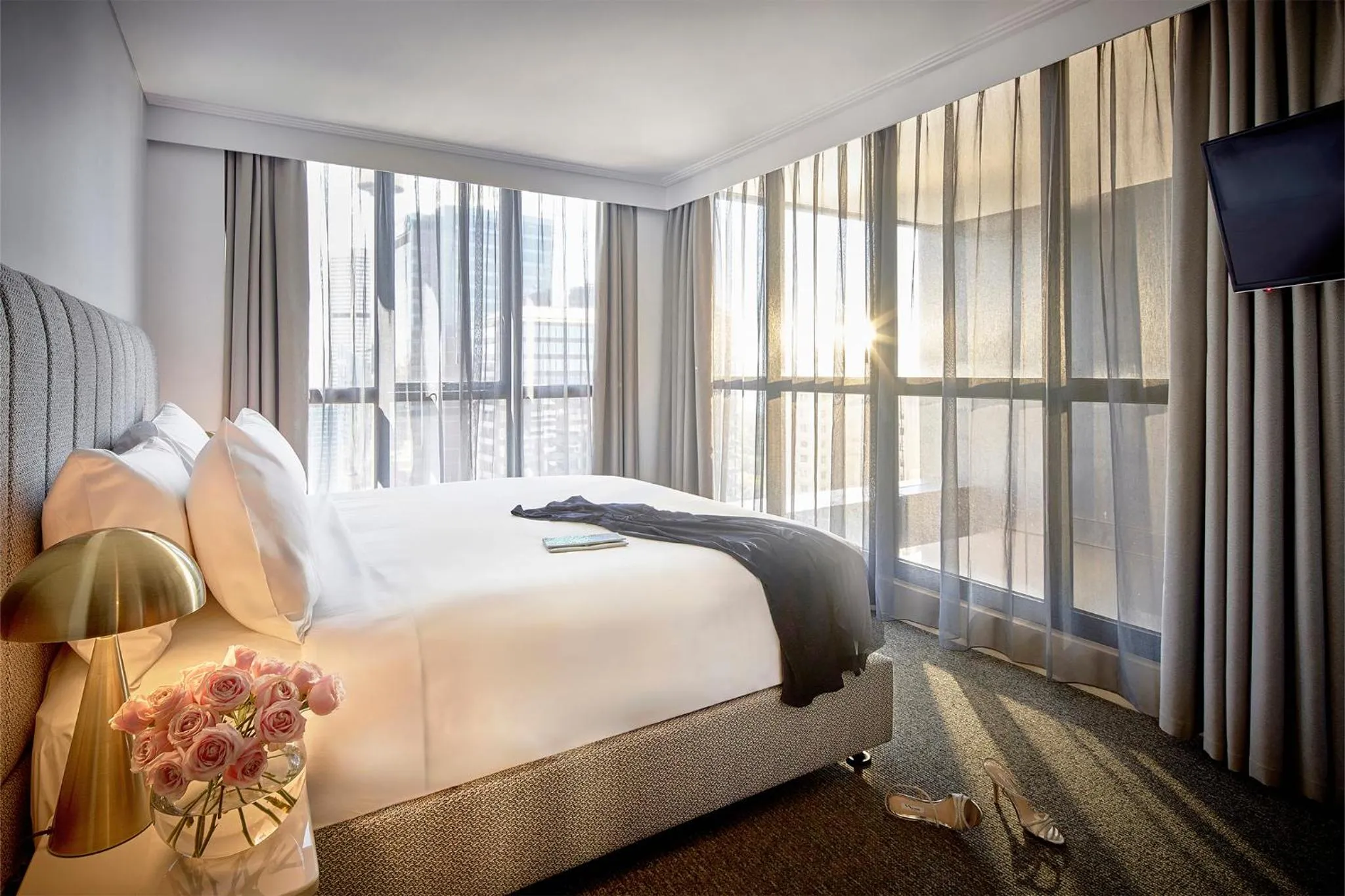 Bed in Meriton Suites Pitt Street, Sydney