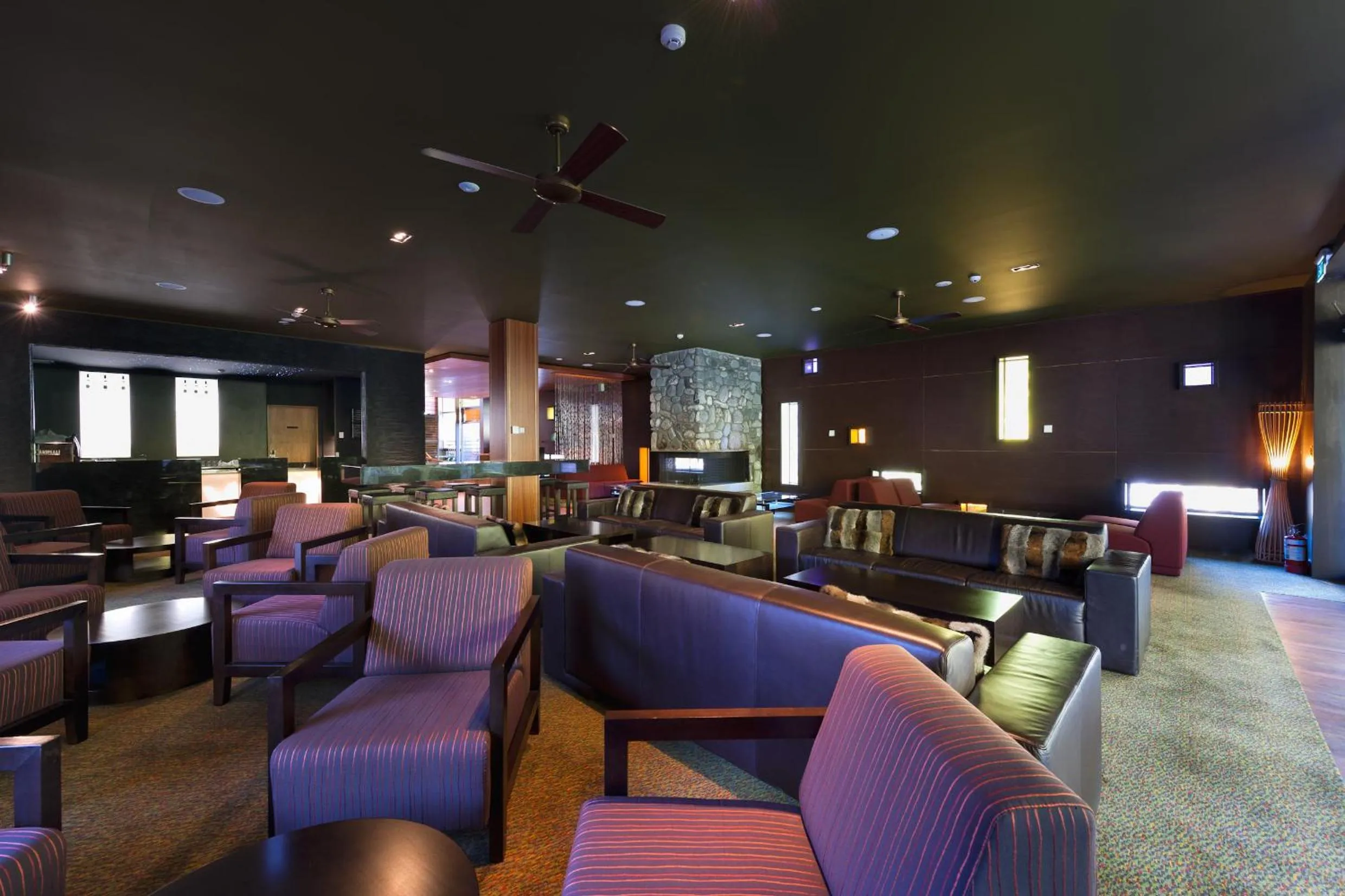 Communal lounge/ TV room in Legacy Te Waonui Hotel Franz Josef