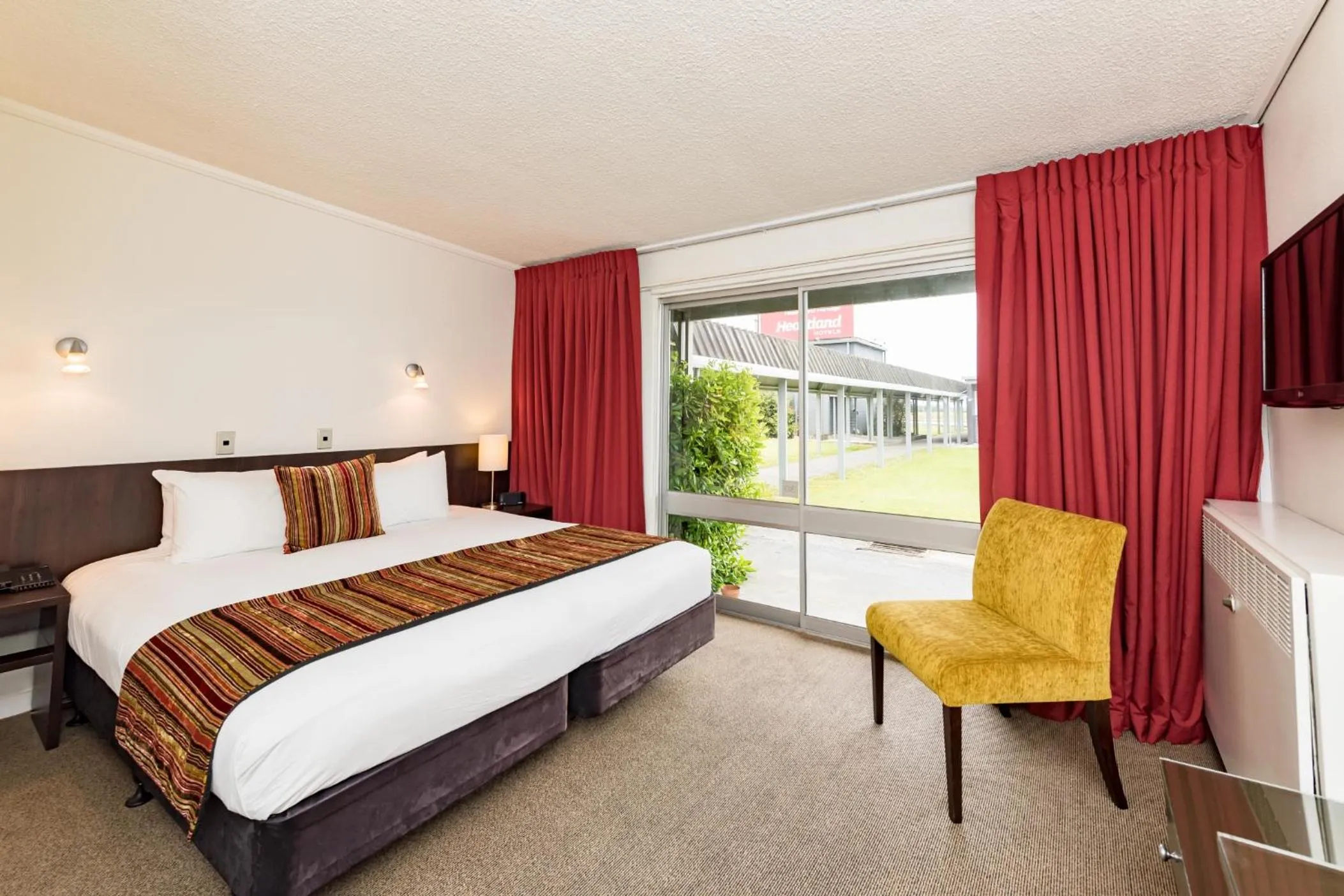 Bed in Heartland Hotel Haast