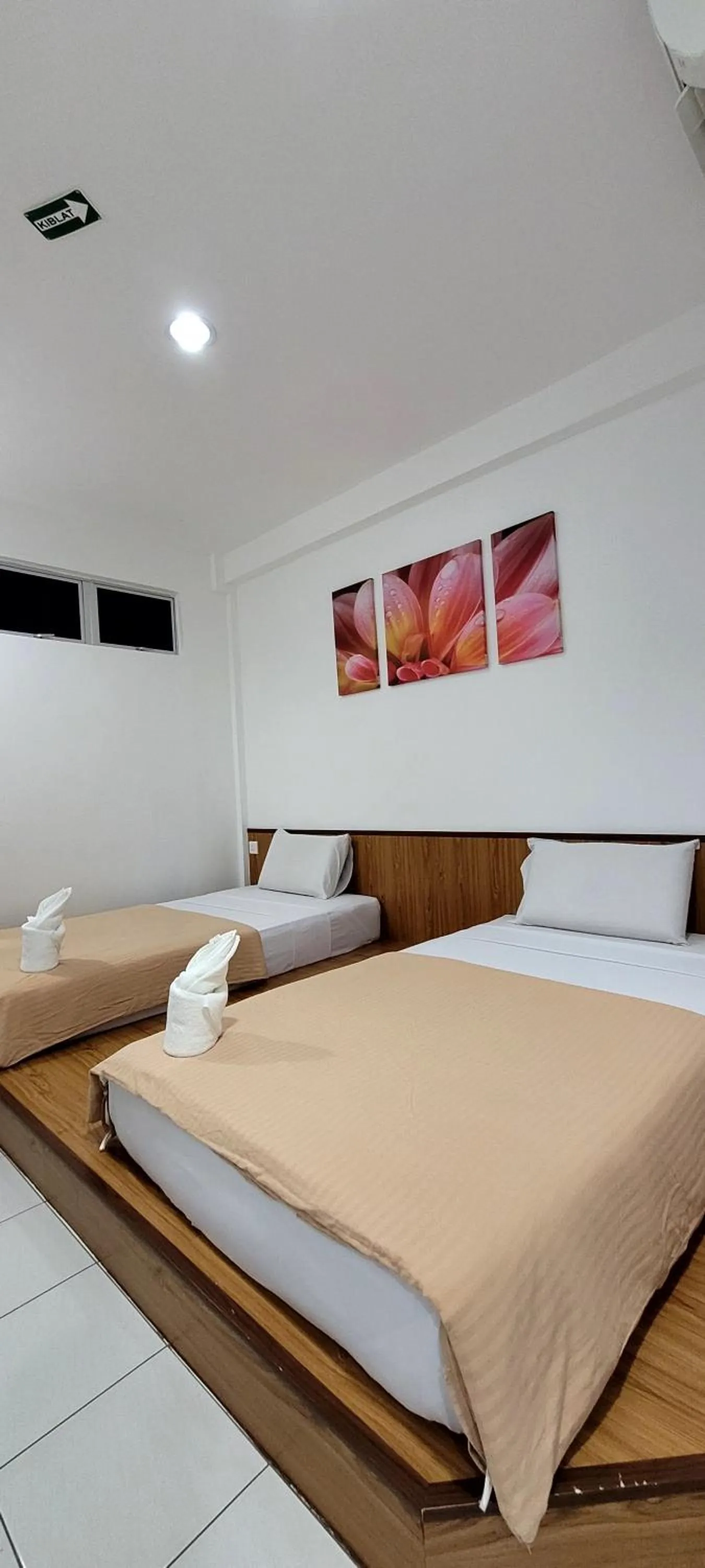 Bed in Api-Api GuestHouse