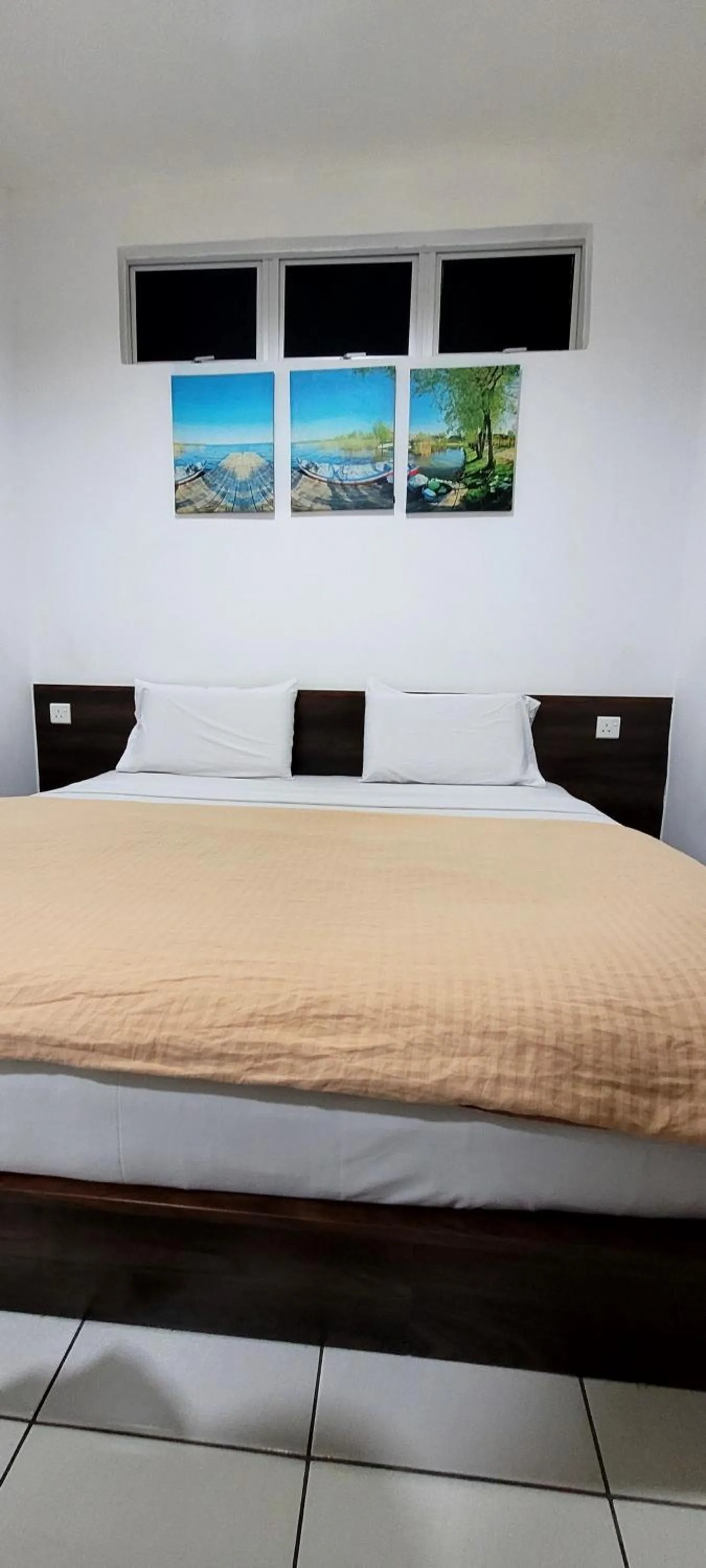 Bed in Api-Api GuestHouse