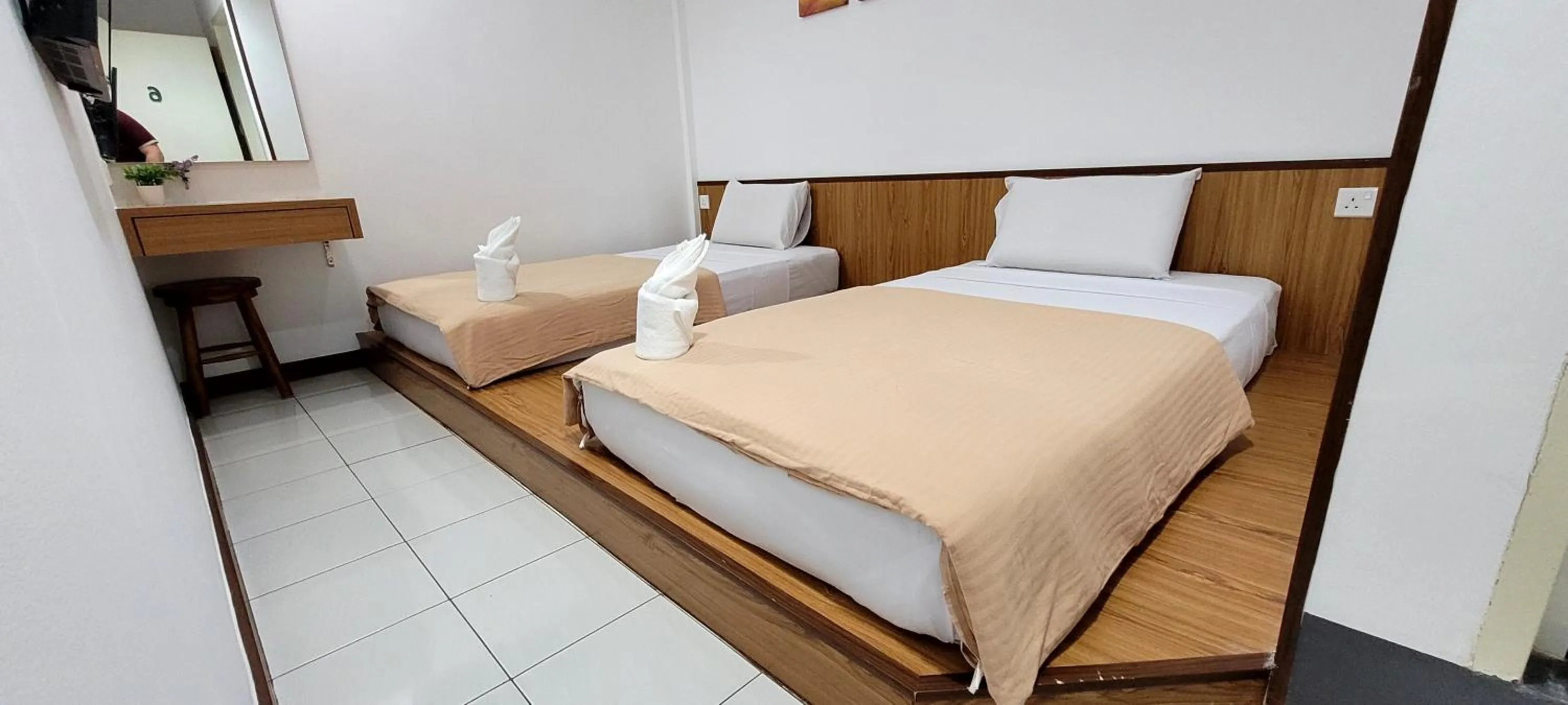 Bed in Api-Api GuestHouse
