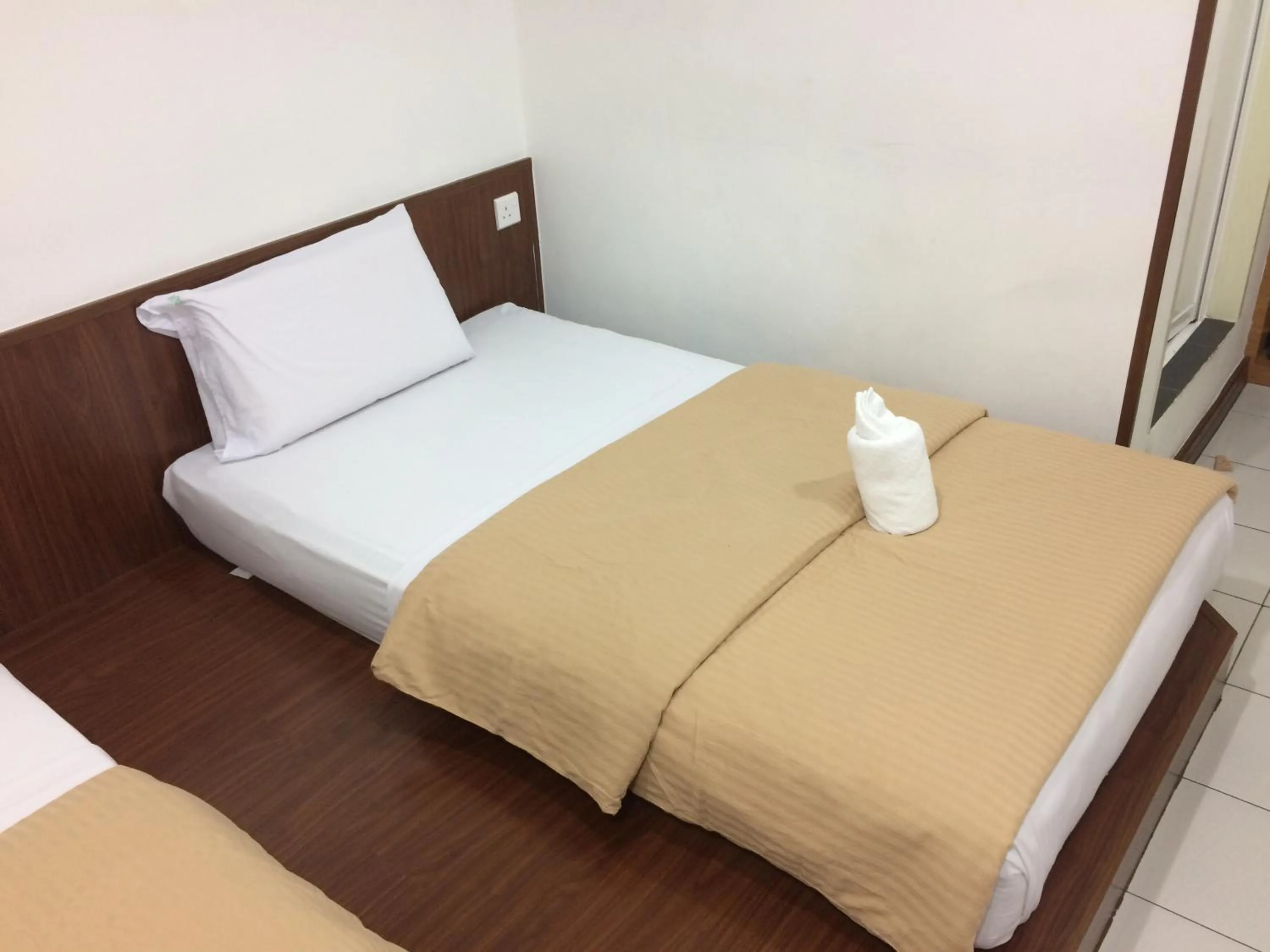 Bed in Api-Api GuestHouse