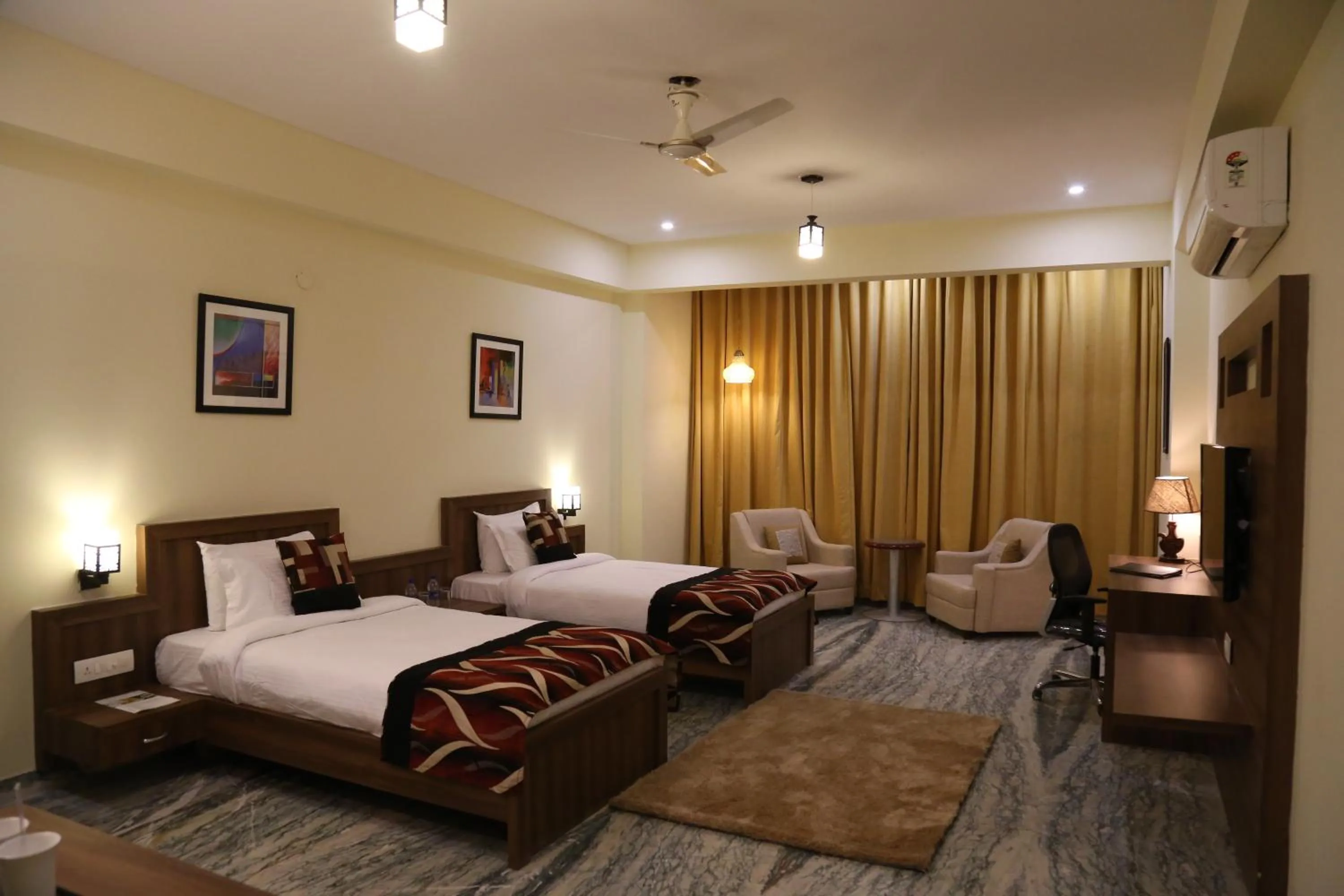 Photo of the whole room, Bed in Regenta Central Mewargarh, Near Biological park