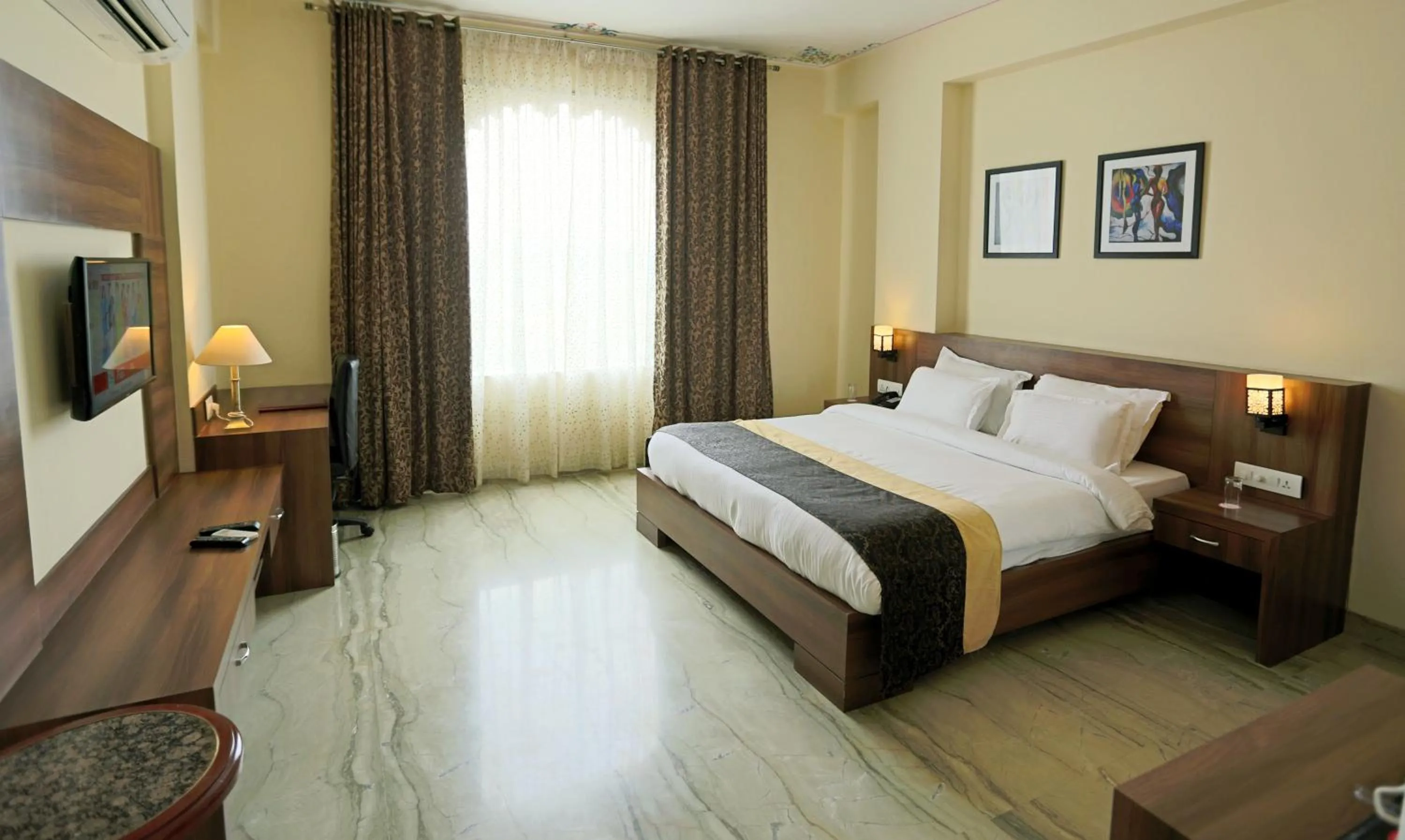 Photo of the whole room, Bed in Regenta Central Mewargarh, Near Biological park