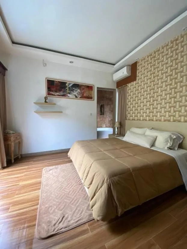 Bed in Muaya Villa