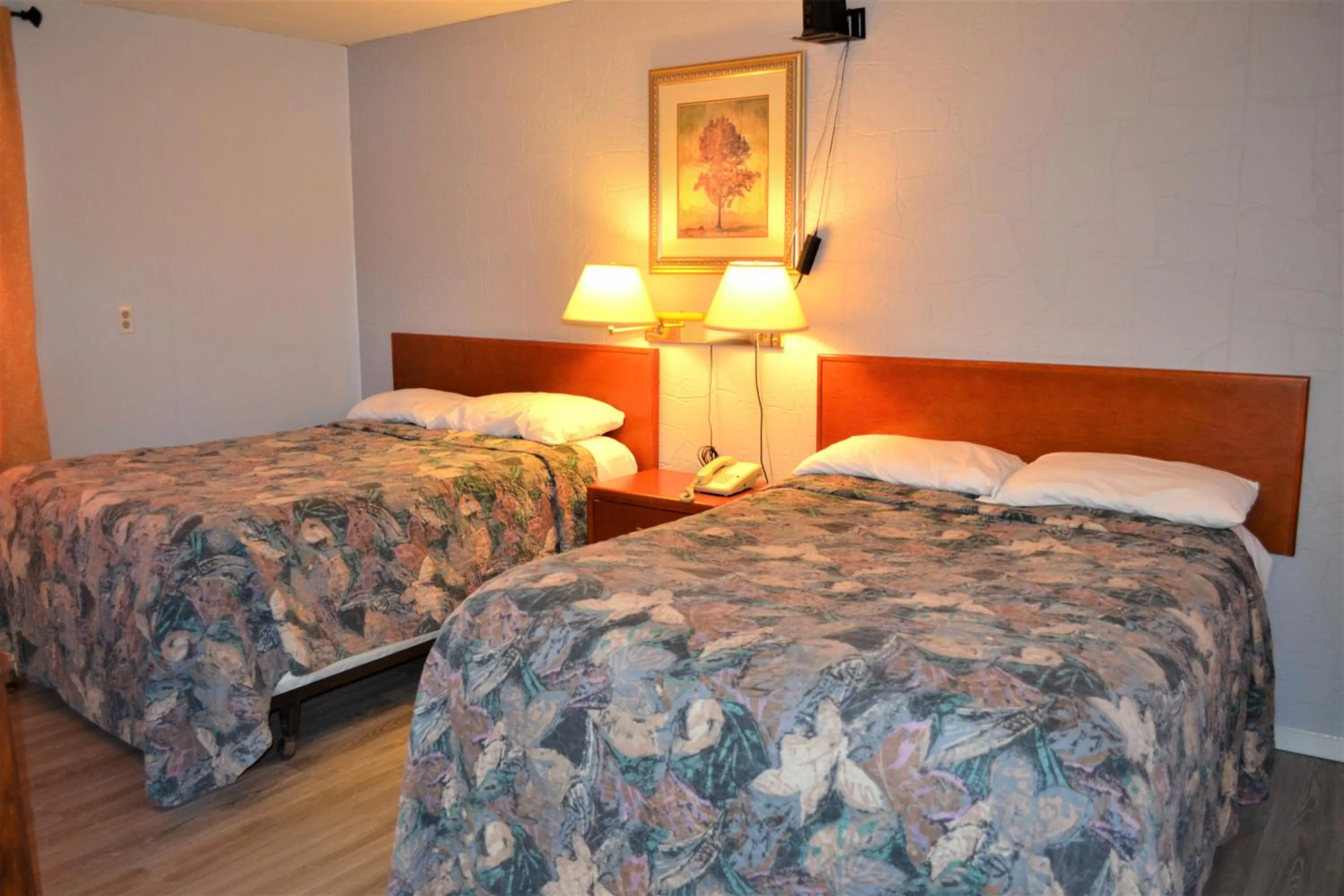 Bed in The Villager Motel