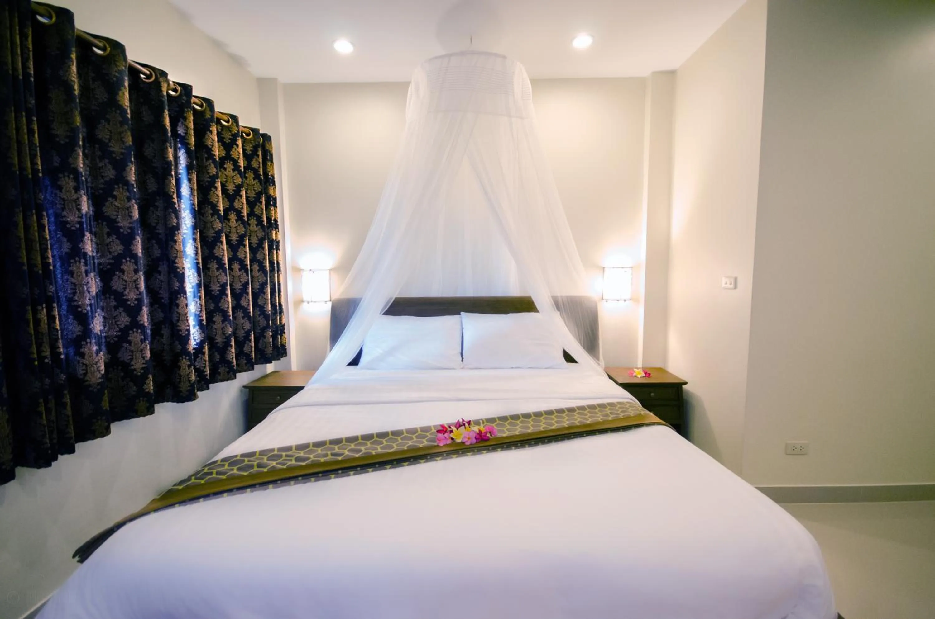 Bed in Namphung Phuket Boutique Resort