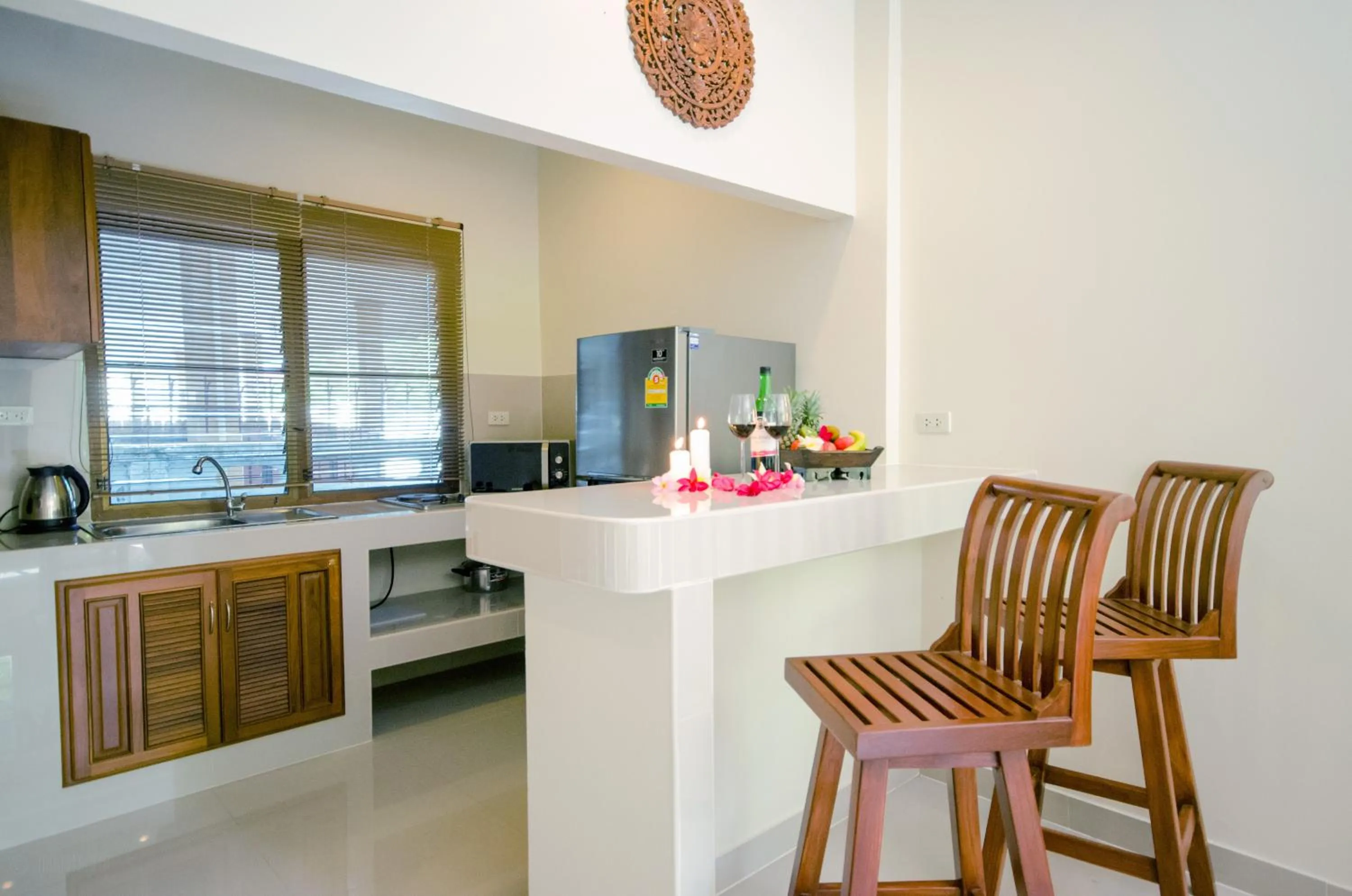 Kitchen or kitchenette in Namphung Phuket Boutique Resort