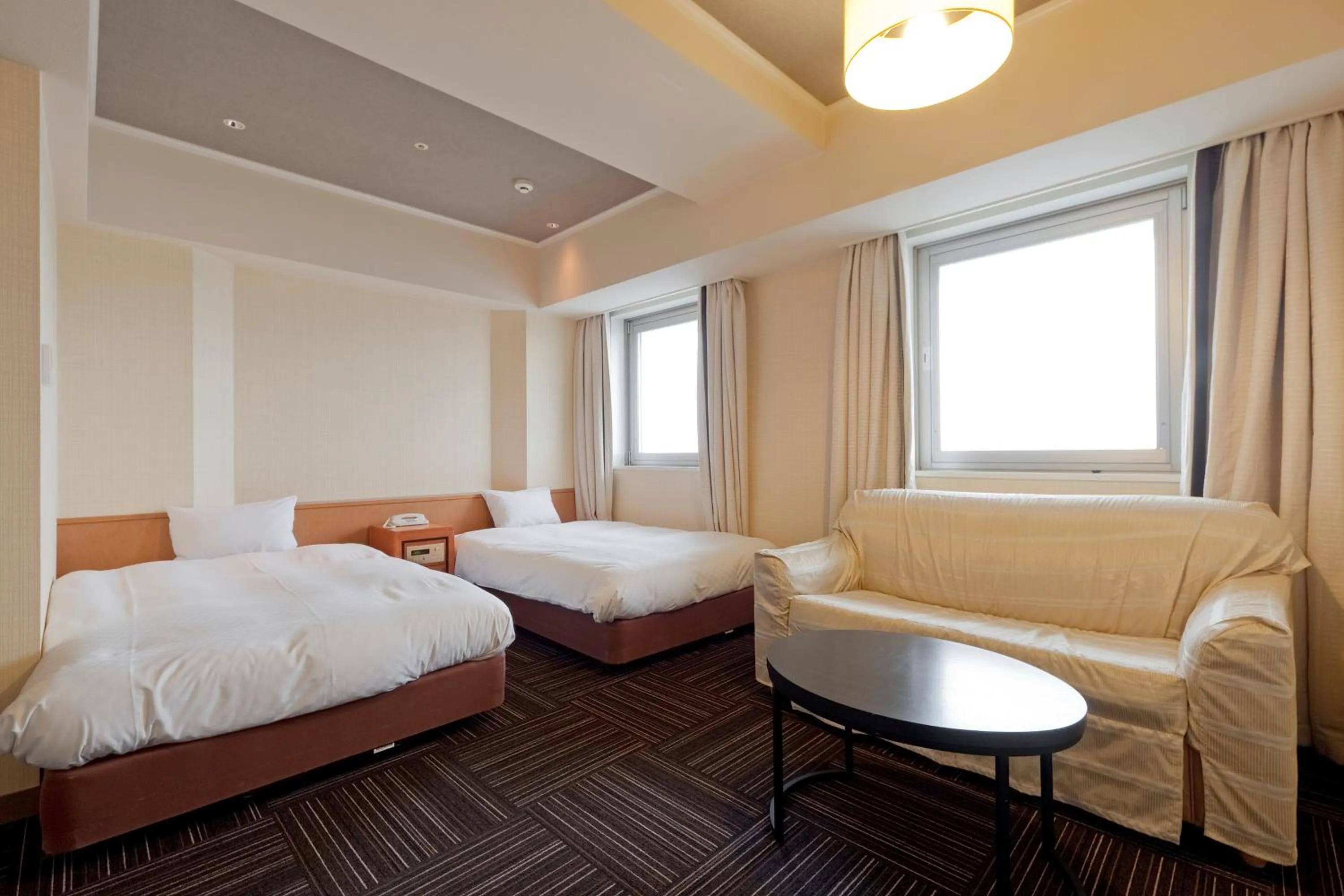 Bed in Kanku Izumiotsu Washington Hotel