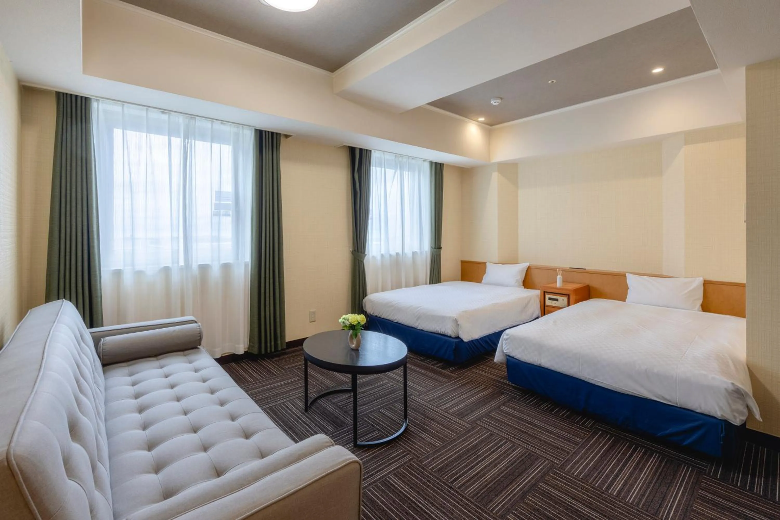 Bed in Kanku Izumiotsu Washington Hotel