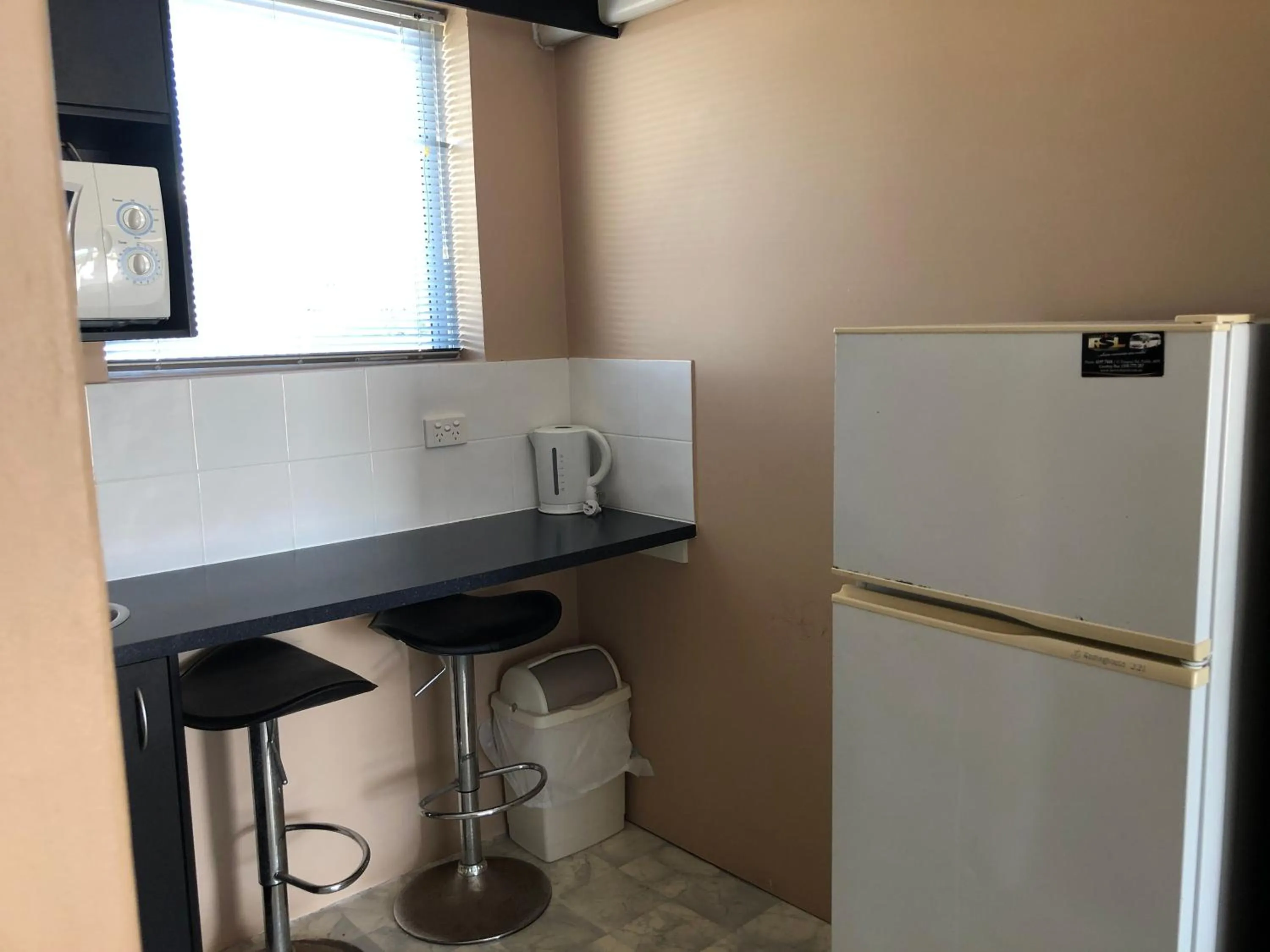 Kitchen or kitchenette in Hervey Bay Motel