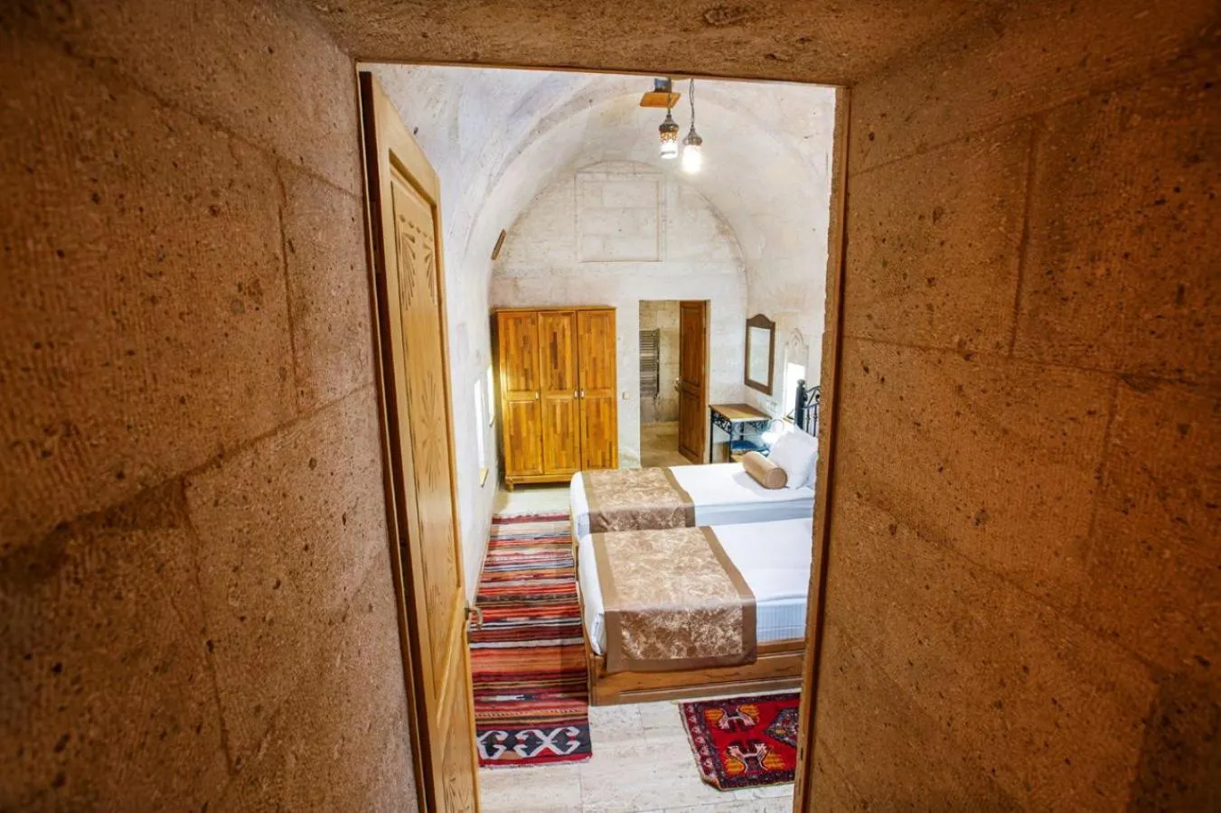 Bed in Caldera Cave Hotel