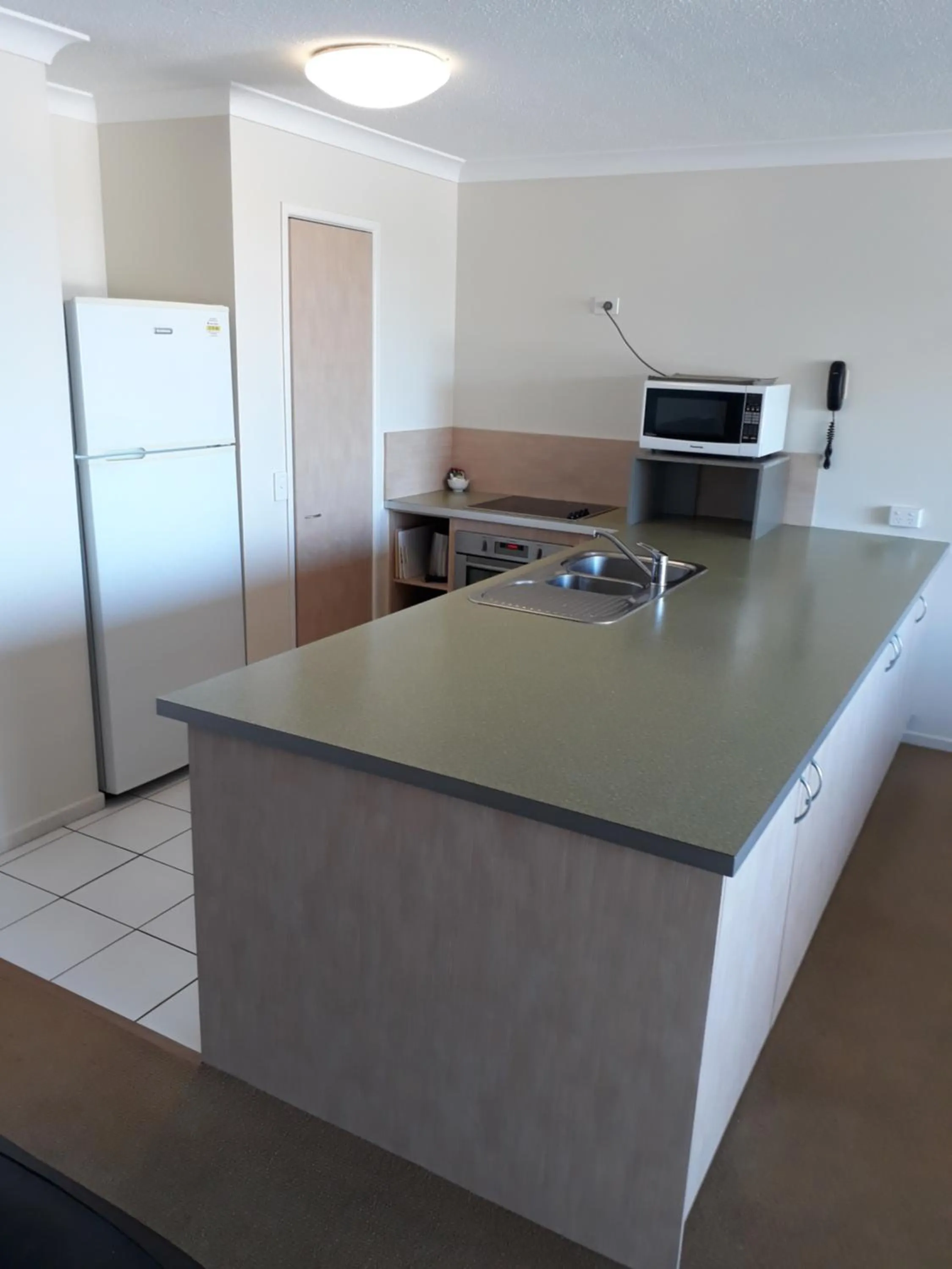 Kitchen or kitchenette in Pandanus Coolum Beach
