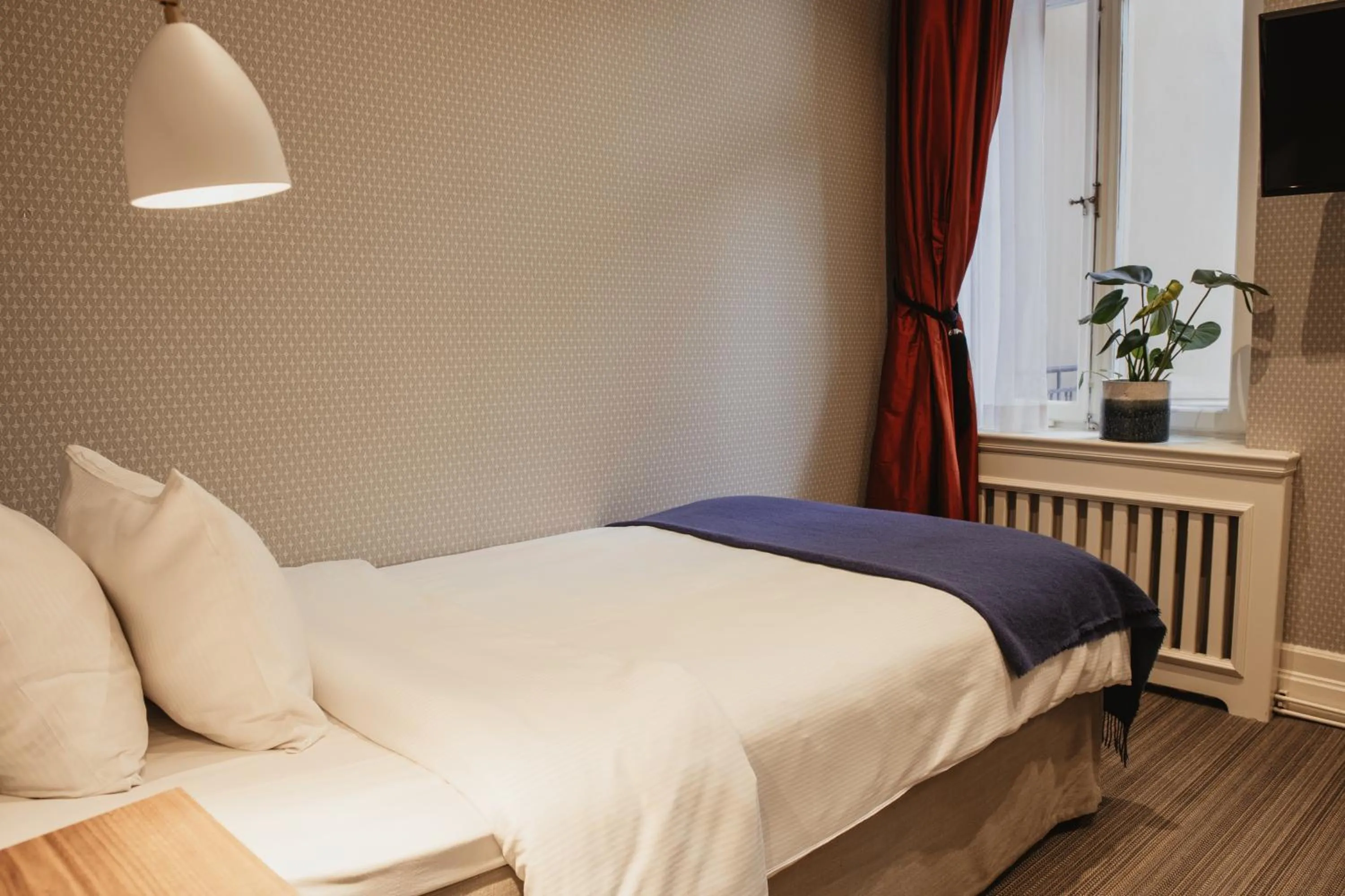 Bed in Home Hotel Wellington