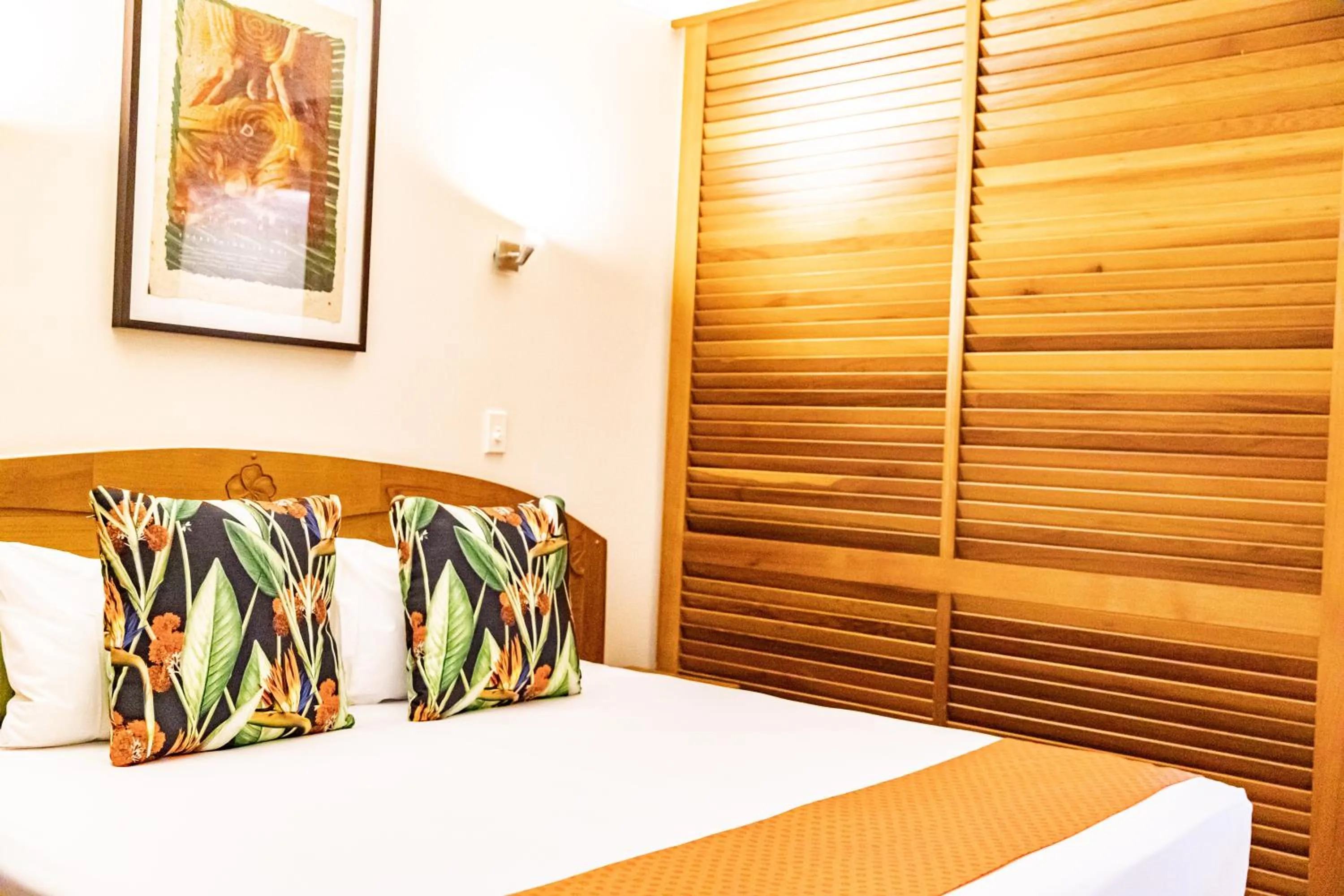Bed in Hibiscus Resort & Spa - Official Onsite Reception & Check In