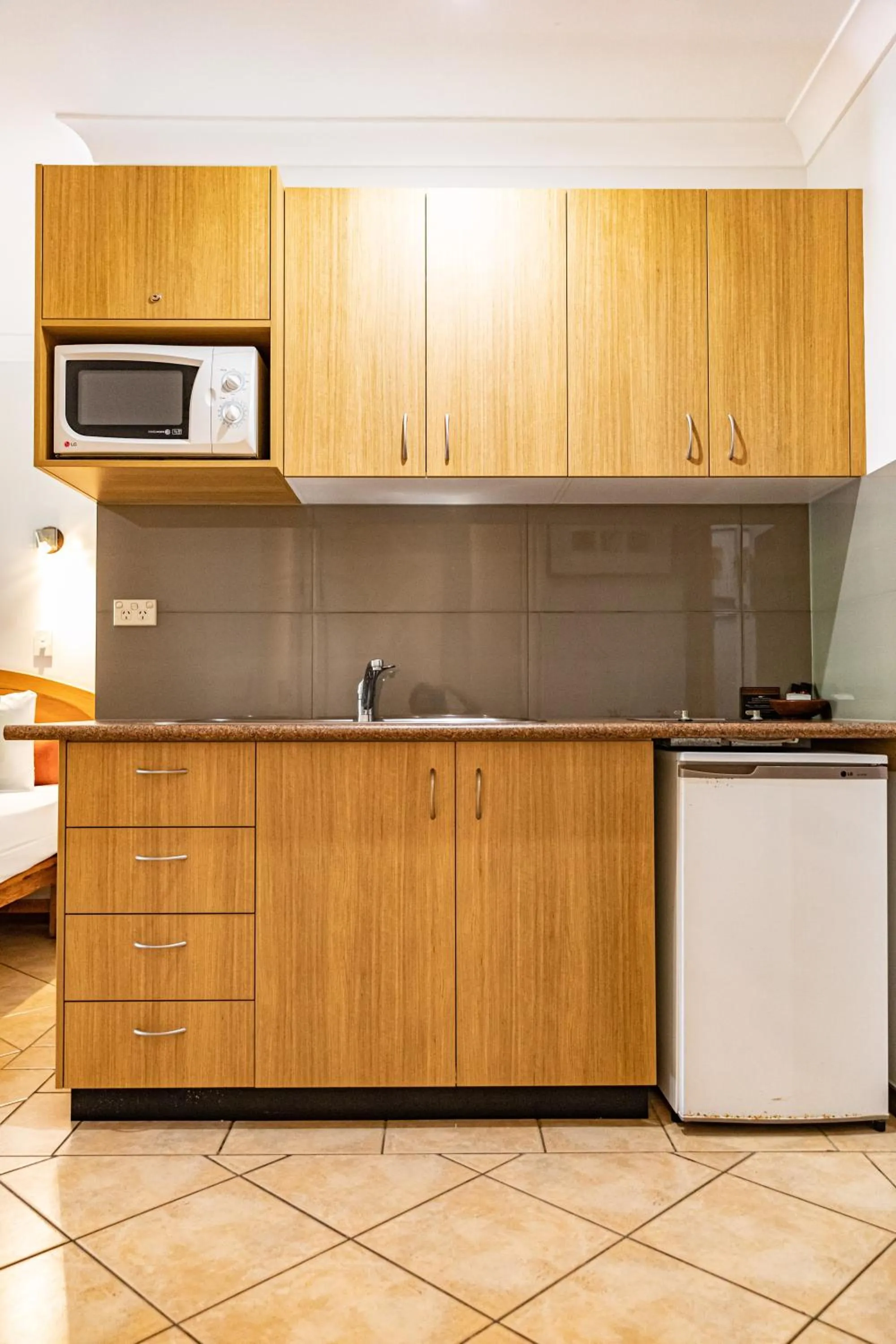Kitchen or kitchenette in Hibiscus Resort & Spa - Official Onsite Reception & Check In