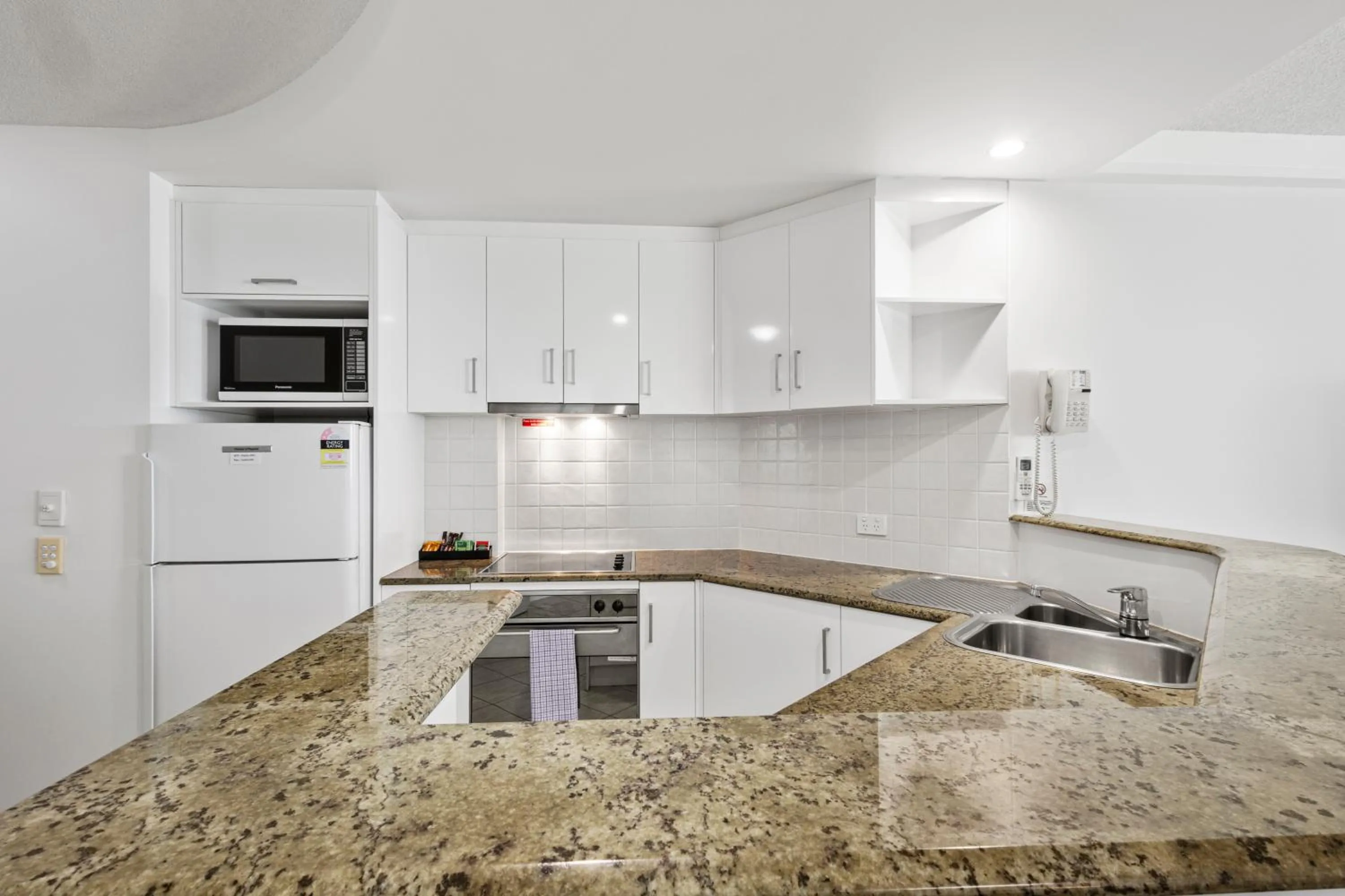 Kitchen or kitchenette in Malibu Apartments