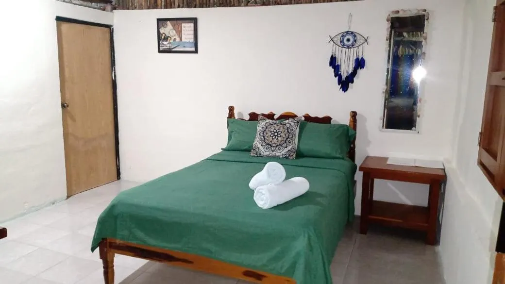 towels, Bed in Cabañas El Cuyo