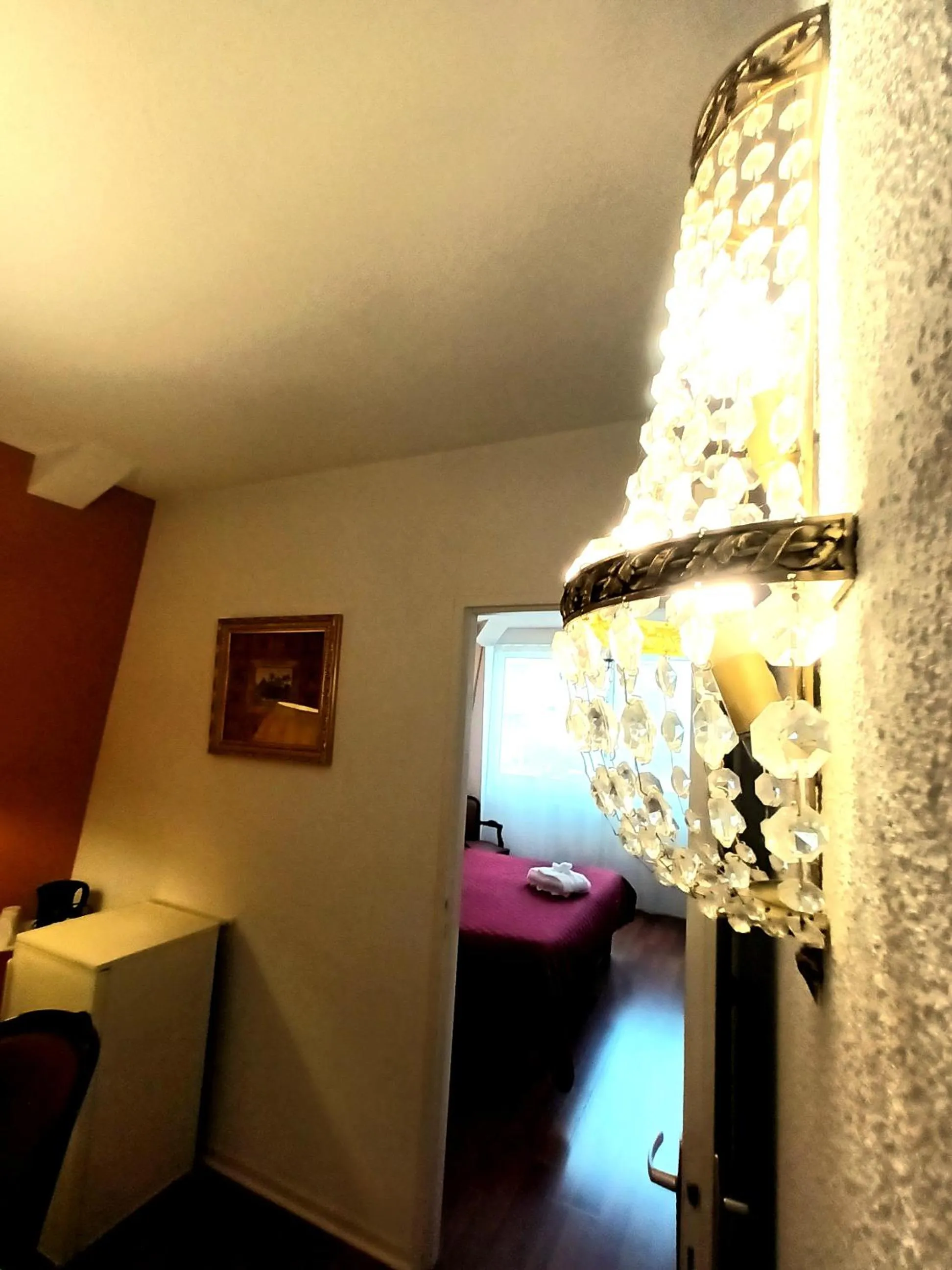 Bedroom in Hôtel Jeanne d'Arc