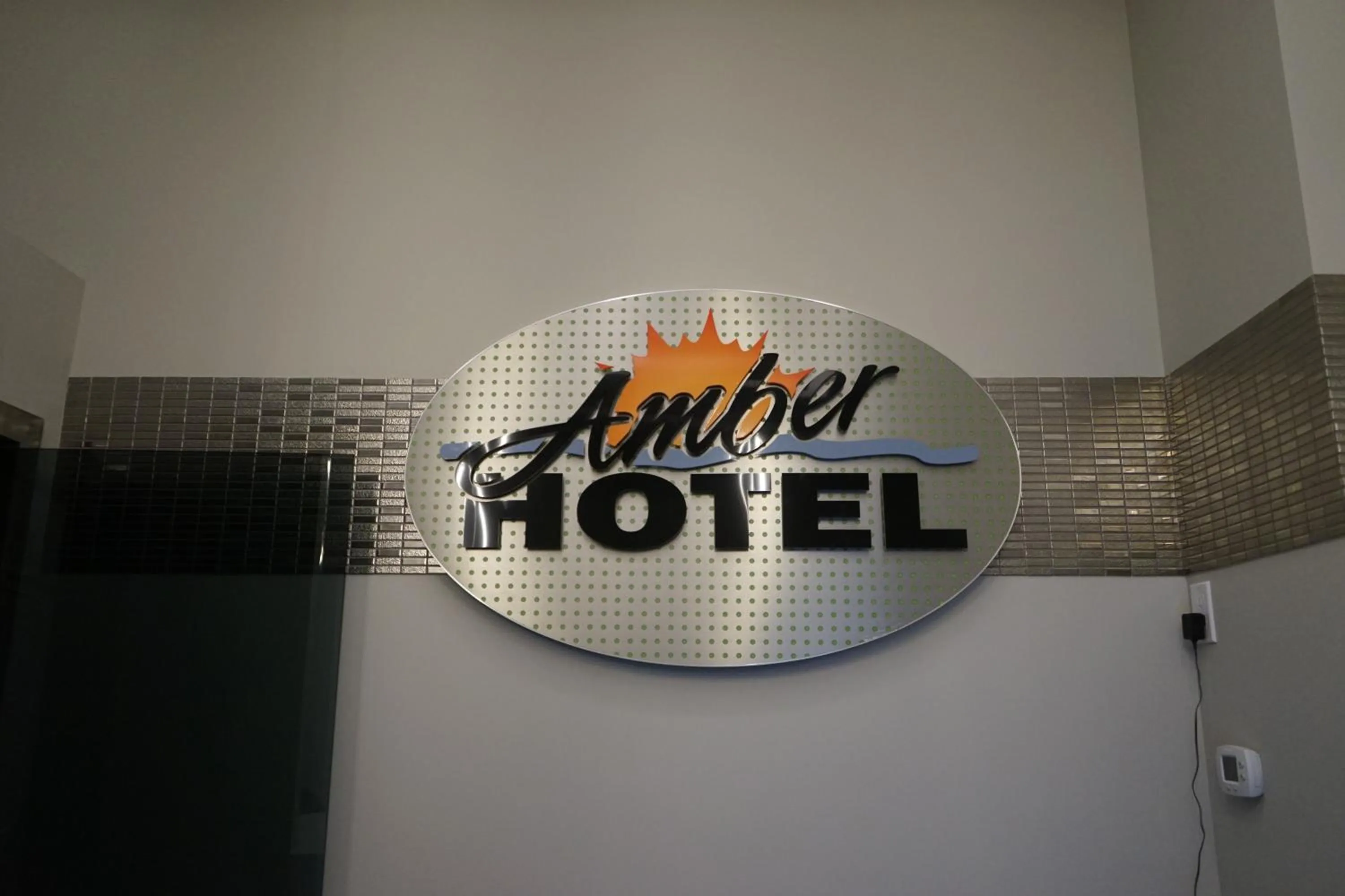 Property logo or sign in Amber Hotel