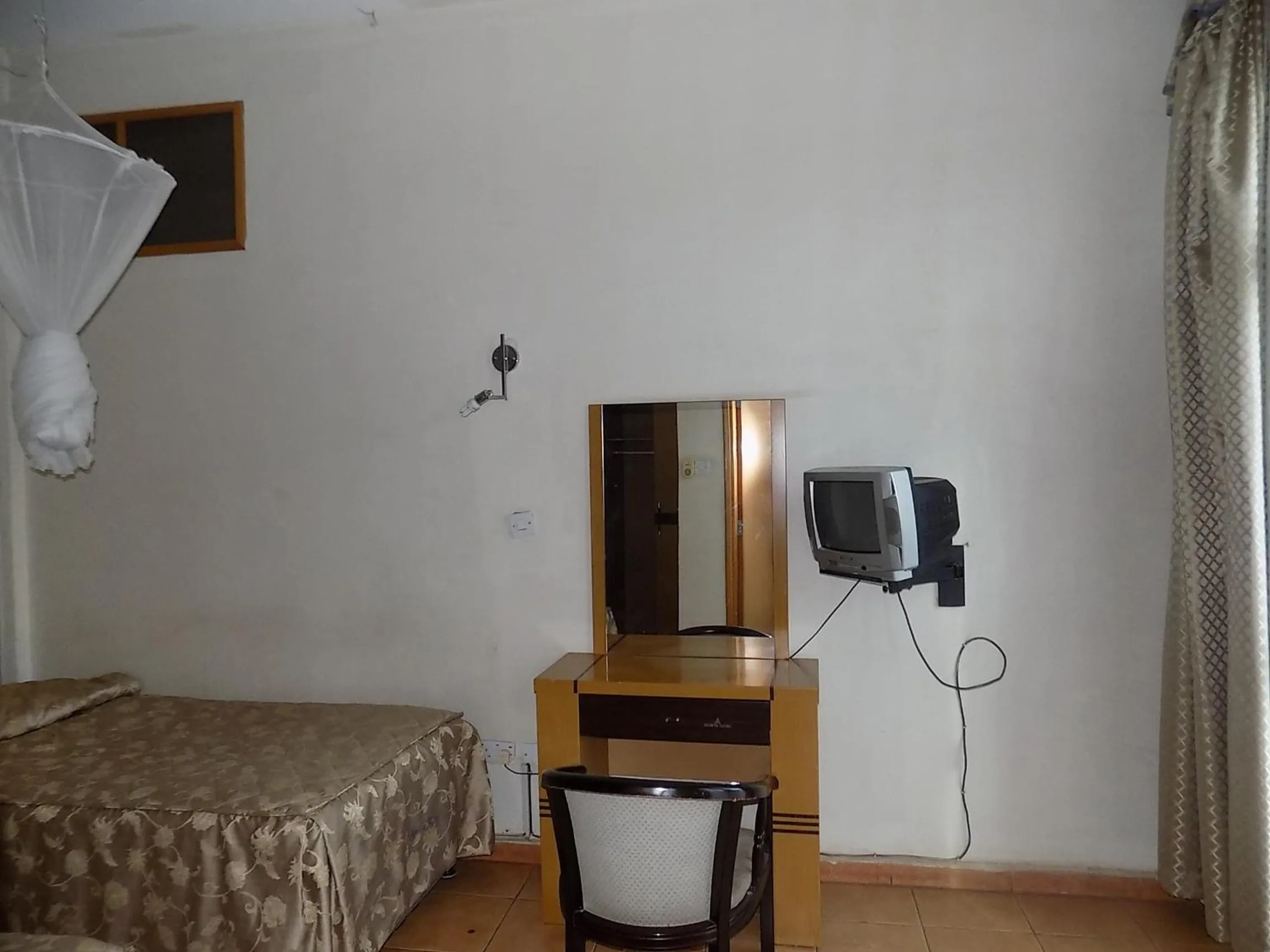 Bed in Aponye Hotel Kampala