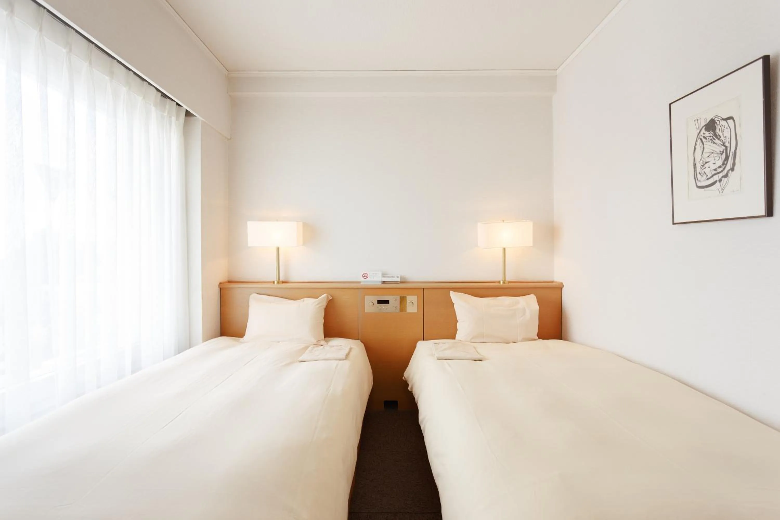 Bed in AkishimaStationHotel TOKYO